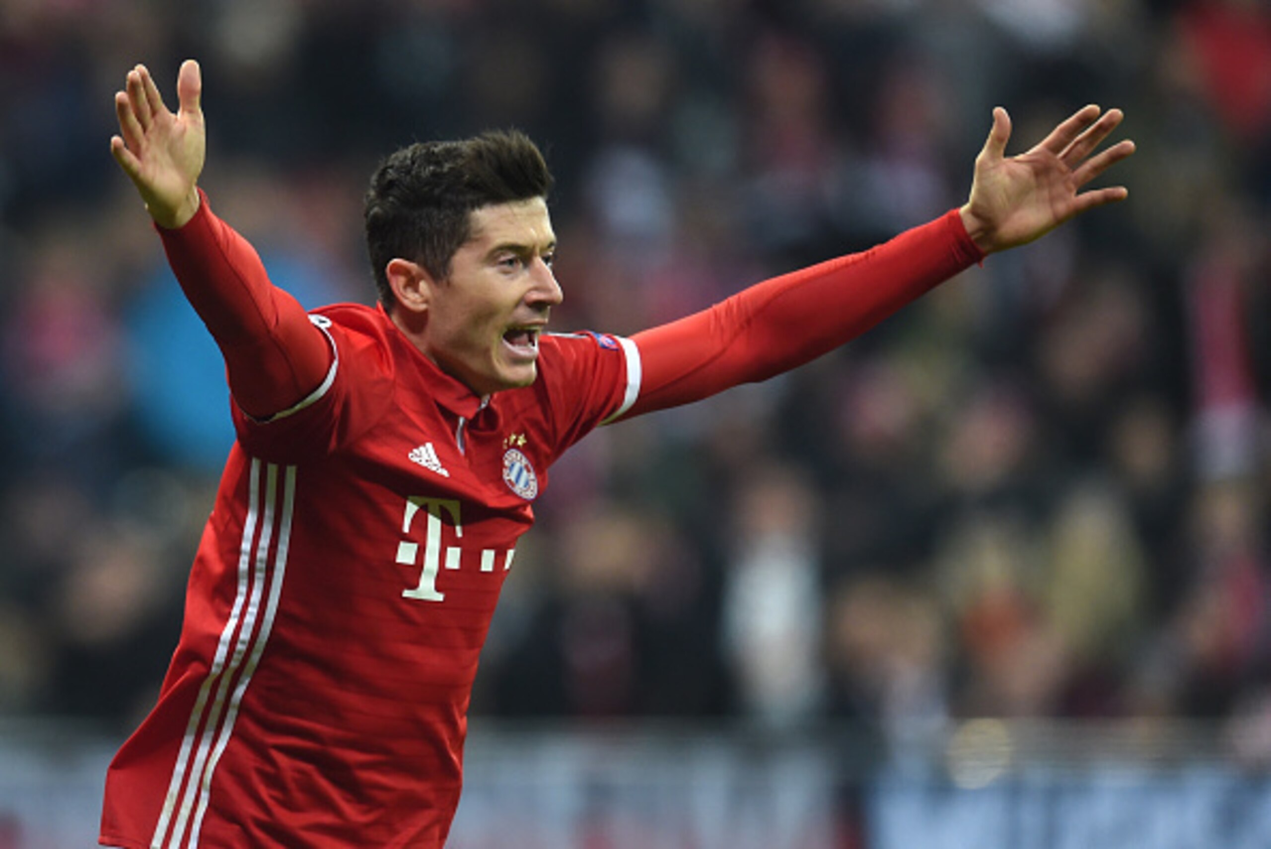 Bayern Munich's Polish striker Robert Lewandowski reacts during the UEFA Champions League round of sixteen football match between FC Bayern Munich and Arsenal in Munich, southern Germany, on February 15, 2017. / AFP / Christof STACHE (Photo credit Bayern Munich's Polish striker Robert Lewandowski reacts during the UEFA Champions League round of sixteen football match between FC Bayern Munich and Arsenal in Munich, southern Germany, on February 15, 2017. / AFP / Christof STACHE (Photo credit
