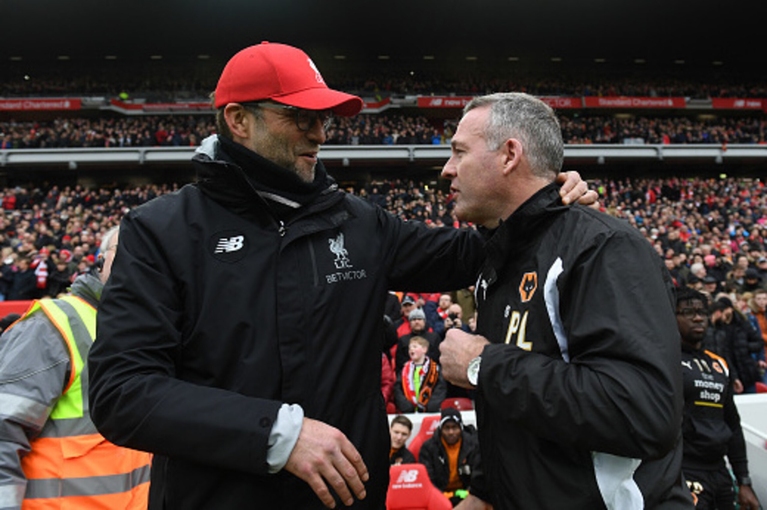 LIVERPOOL, ENGLAND - JANUARY 28: Jurgen Klopp manager / head coach of Liverpool and Paul Lambert manager / head coach of Wolverhampton Wanderers during The Emirates FA Cup Fourth Round between Liverpool and Wolverhampton Wanderers at Anfield on January 28