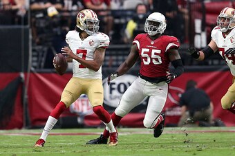 GLENDALE, AZ - NOVEMBER 13: Quarterback Colin Kaepernick #7 of the San Francisco 49ers is chased by outside linebacker Chandler Jones #55 of the Arizona Cardinals during the first quarter of the NFL football game at University of Phoenix Stadium on Novemb
