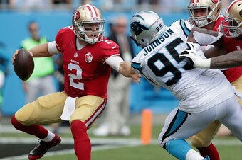 CHARLOTTE, NC - SEPTEMBER 18:  Blaine Gabbert #2 of the San Francisco 49ers scrambles from  Charles Johnson #95 of the Carolina Panthers in the 2nd quarter during their game at Bank of America Stadium on September 18, 2016 in Charlotte, North Carolina.  (