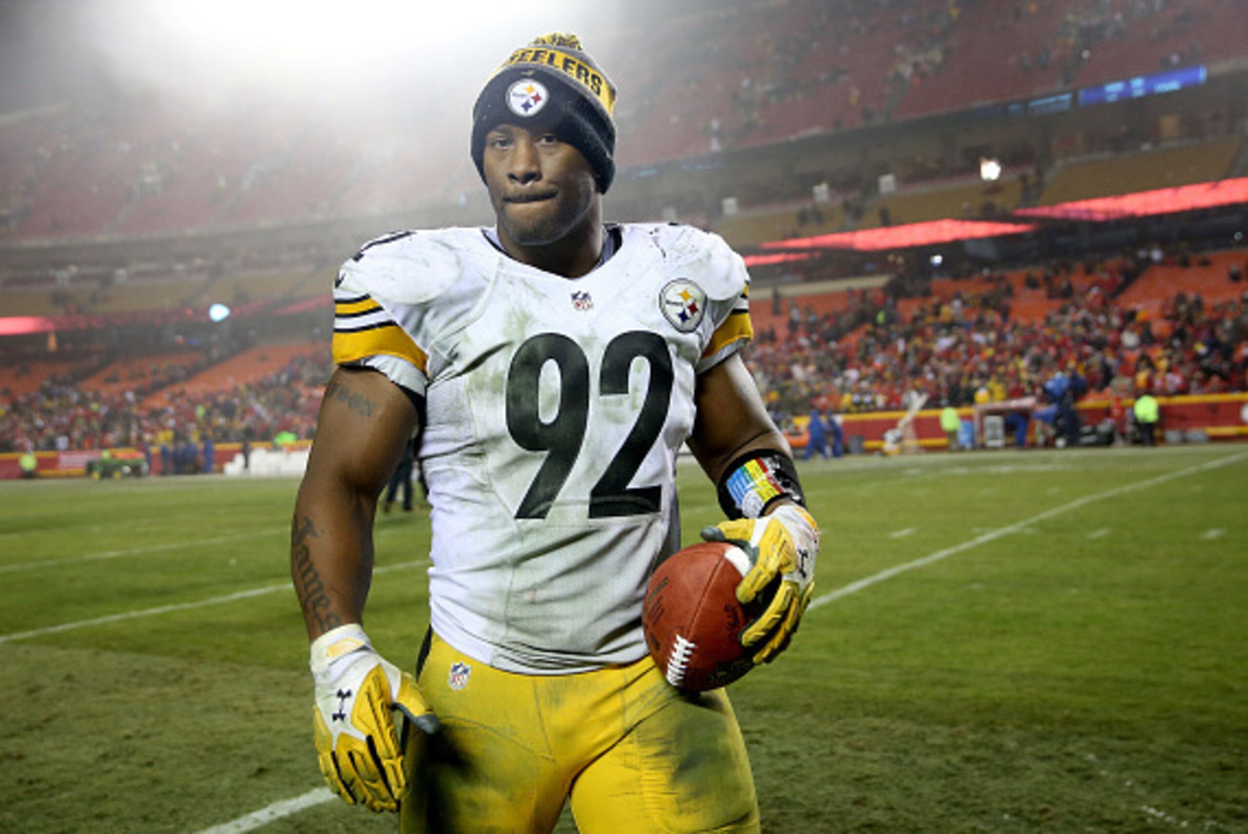 KANSAS CITY, MP - JANUARY 15: Outside linebacker James Harrison #92 of the Pittsburgh Steelers walks off of the field with a Sunday Night Football game ball following the Steelers victory over the Kansas City Chiefs in the AFC Divisional Playoff game at A