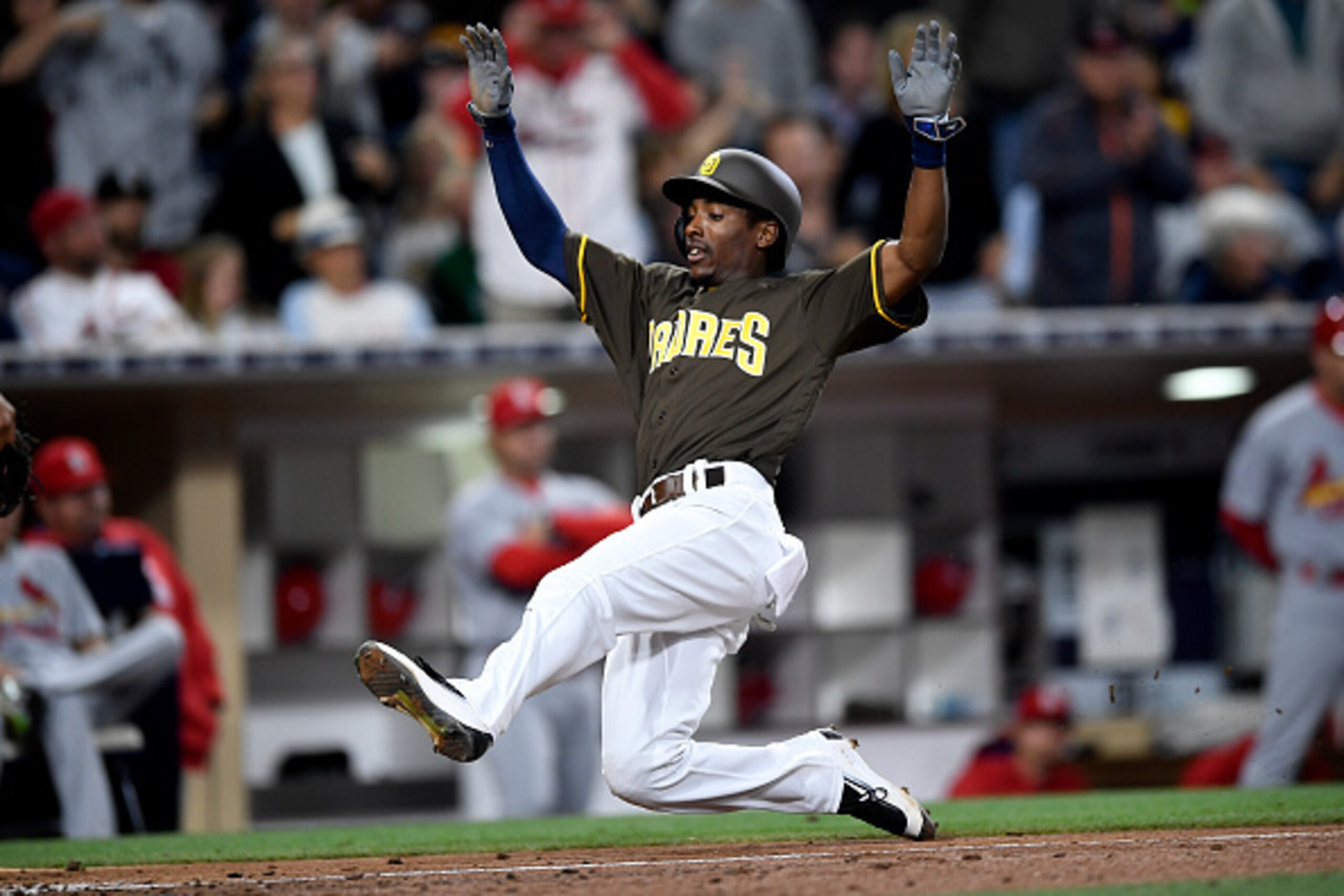 SAN DIEGO, CA - APRIL 22: Jemile Weeks #8 of the San Diego Padres slides into home plate and scores a run during a game against the St Louis Cardinals at Petco Park on April 22, 2016 in San Diego, California. (Photo by Andy Hayt/San Diego Padres/Getty Ima