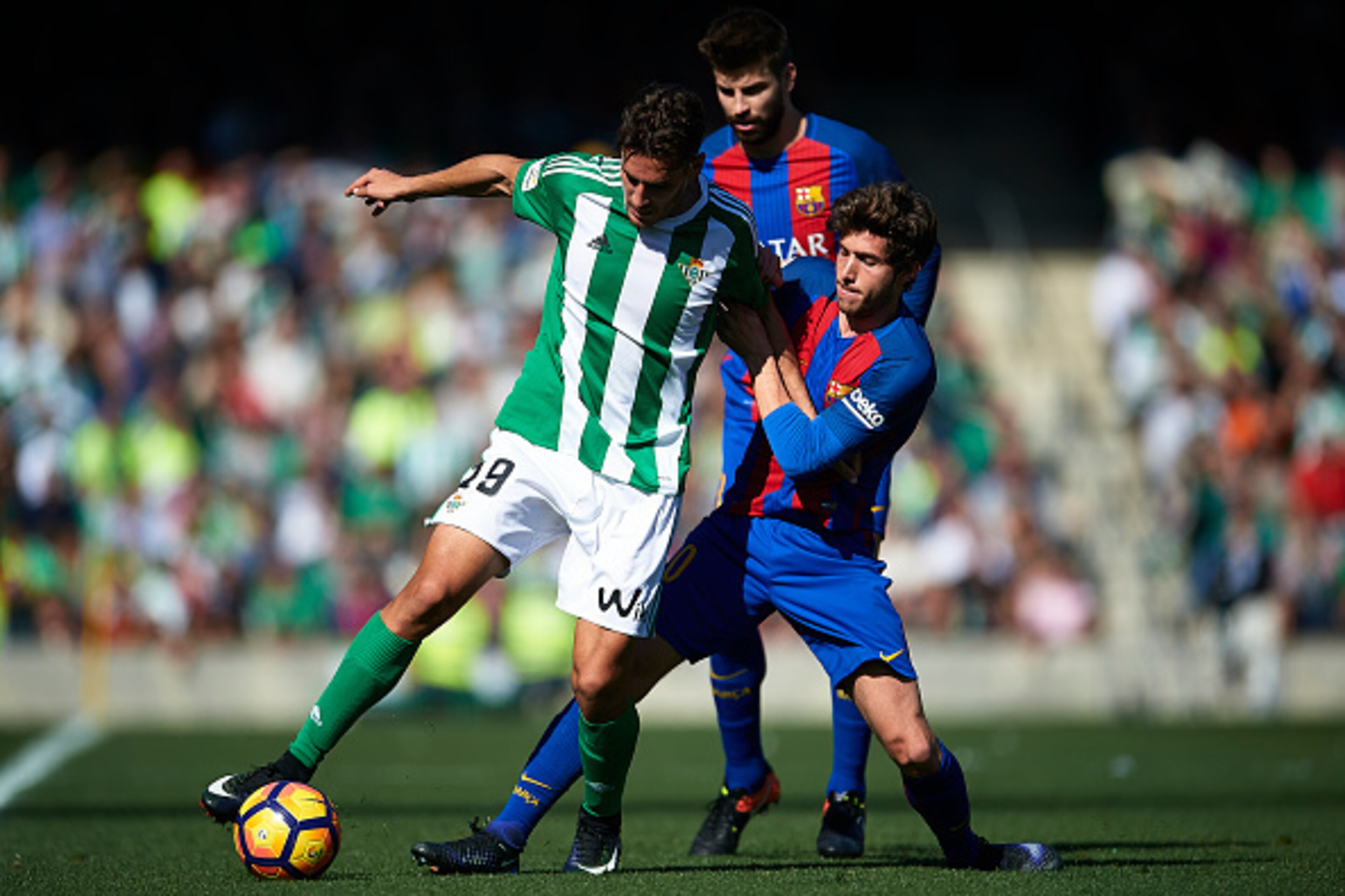 SEVILLE, SPAIN - JANUARY 29: Alex Alegria of Real Betis Balompie (L) competes for the ball with Sergio Roberto of FC Barcelona (R) during La Liga match between Real Betis Balompie and FC Barcelona at Benito Villamarin Stadium on January 29, 2017 in Sevi SEVILLE, SPAIN - JANUARY 29: Alex Alegria of Real Betis Balompie (L) competes for the ball with Sergio Roberto of FC Barcelona (R) during La Liga match between Real Betis Balompie and FC Barcelona at Benito Villamarin Stadium on January 29, 2017 in Sevi