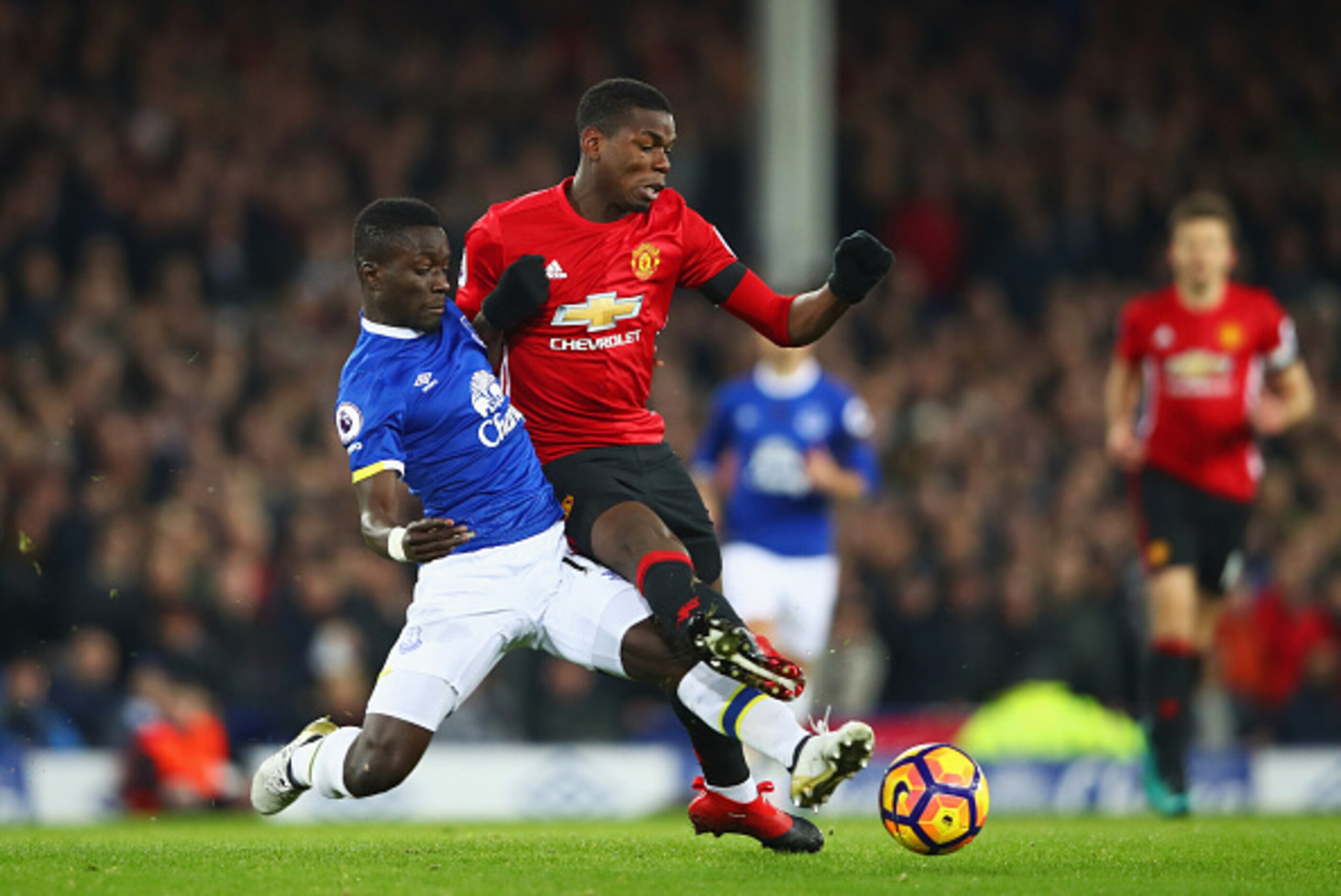 LIVERPOOL, ENGLAND - DECEMBER 04:  Paul Pogba of Manchester United is challenged by Idrissa Gueye of Everton during the Premier League match between Everton and Manchester United at Goodison Park on December 4, 2016 in Liverpool, England.  (Photo by Clive