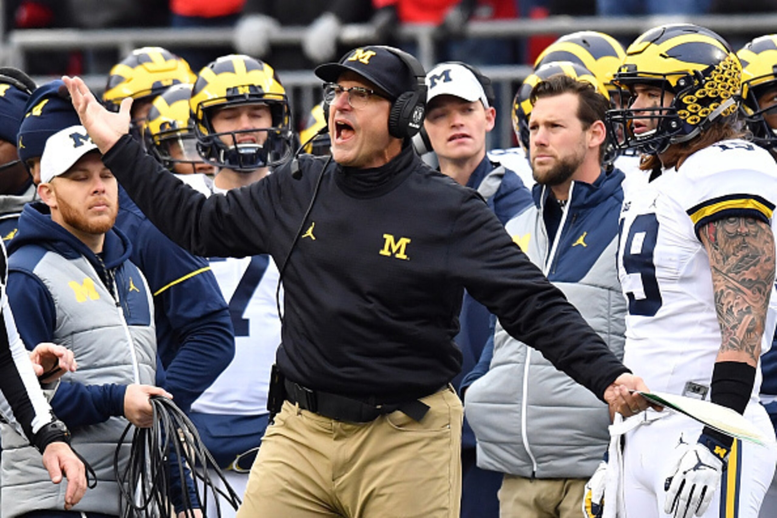 COLUMBUS, OH - NOVEMBER 26:   Head coach Jim Harbaugh of the Michigan Wolverines argues a call on the sideline during the second half against the Ohio State Buckeyes at Ohio Stadium on November 26, 2016 in Columbus, Ohio.  (Photo by Jamie Sabau/Getty Imag