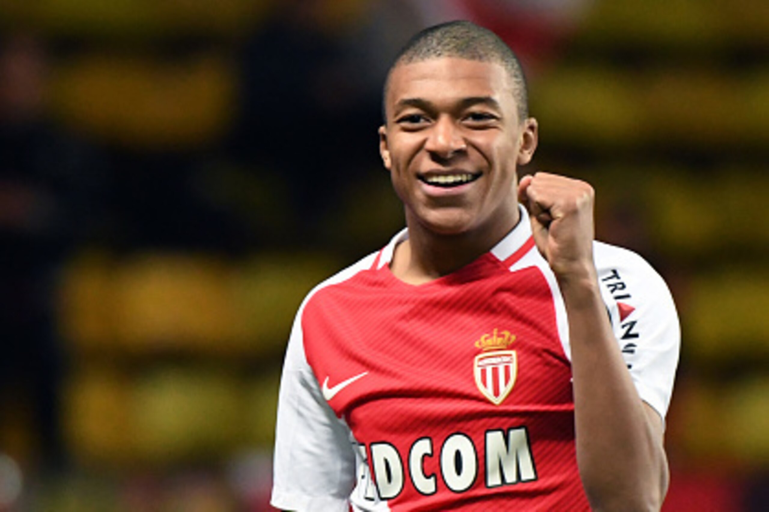 Monaco's French forward Kylian Mbappe Lottin celebrates after scoring a goal during the French Ligue 1 football match between AS Monaco and Metz (FCM) at the Louis II Stadium in Monaco on February 11, 2017.  / AFP / Yann COATSALIOU        (Photo credit sh