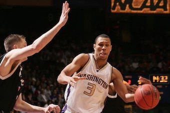 BOISE, ID - MARCH 19:  Brandon Roy #3 of the Washington Huskies drives with the ball against the Pacific Tigers defense during the 2005 NCAA division 1 men's basketball championship tournament game at Taco Bell Arena on March 19, 2005 in Boise, Idaho.   (
