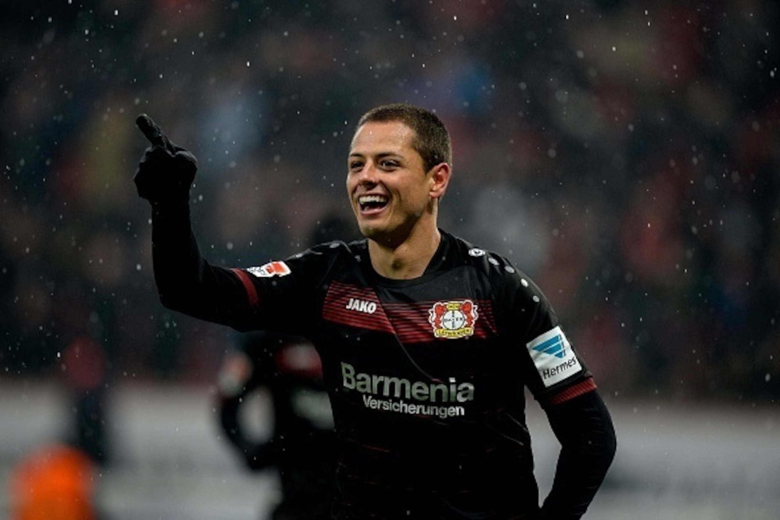 Leverkusen's Mexican forward Javier Hernandez (Chicharito) celebrates scoring the 2-0 during the German First division Bundesliga football match between Bayer Leverkusen and Eintracht Frankfurt in Leverkusen, western Germany, on February 11, 2017. / AFP /