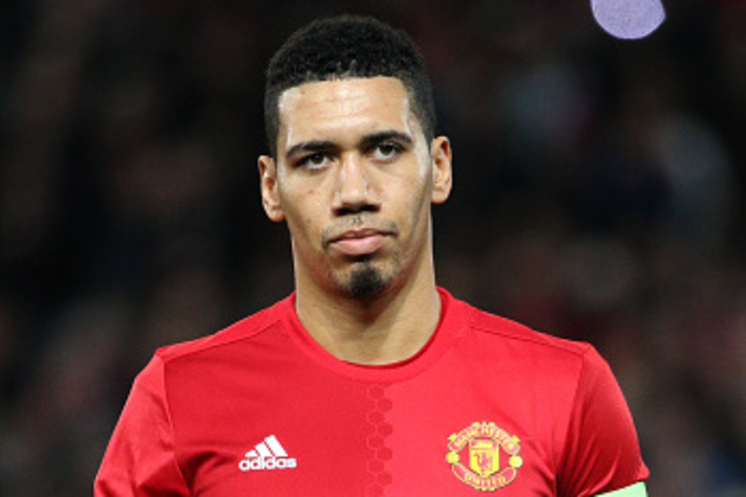 MANCHESTER, ENGLAND - FEBRUARY 16: Chris Smalling of Manchester United looks on before the UEFA Europa League Round of 32 first leg match between Manchester United and AS Saint-Etienne (ASSE) at Old Trafford stadium on February 16, 2017 in Manchester, Uni
