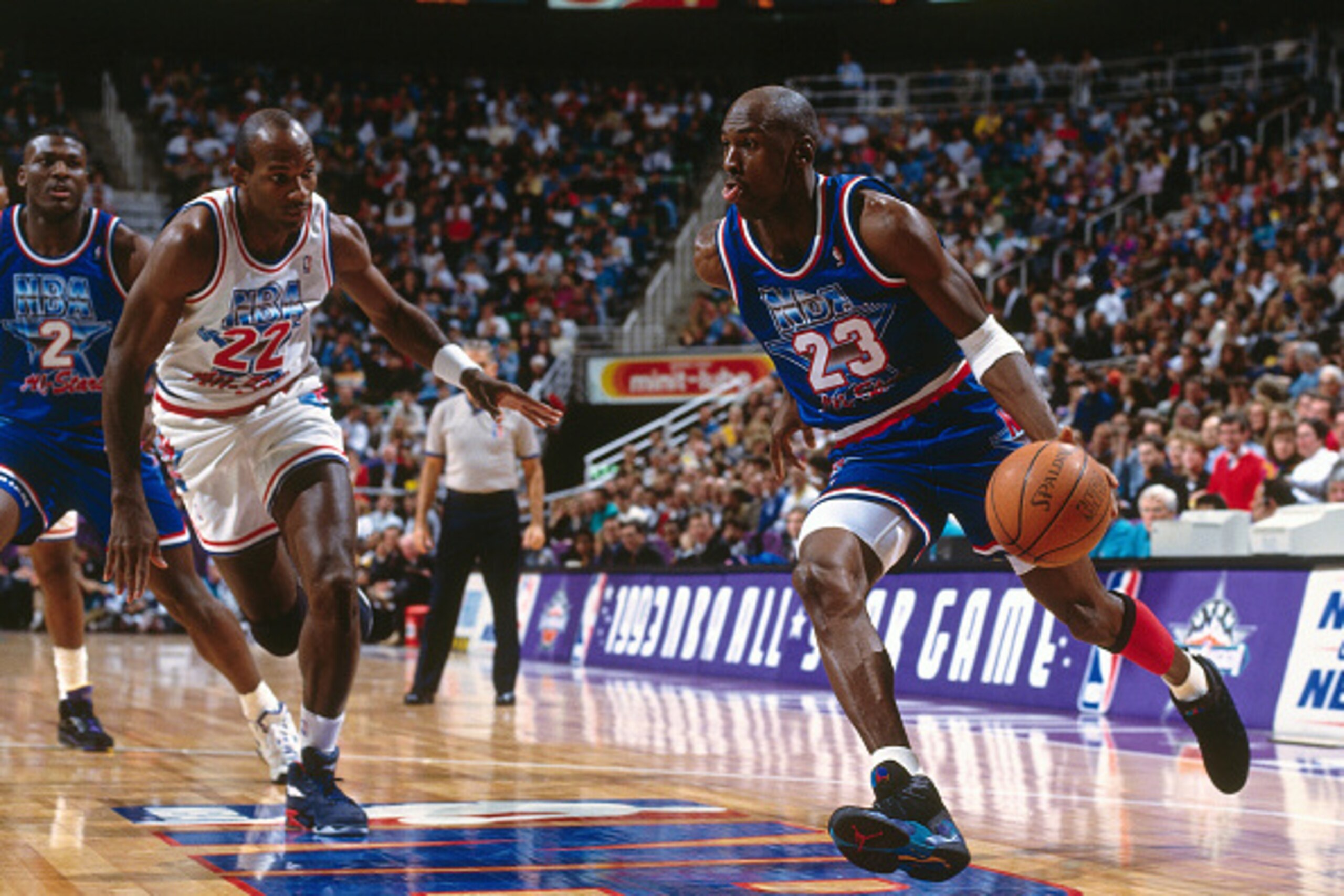 SALT LAKE CITY, UT - FEBRUARY 21: Michael Jordan #23 of the Eastern Conference All-Stars drives against Clyde Drexler #22 of the Western Conference All-Stars during the 1993 All-Star Game on February 21, 1993 at the Delta Center in Salt Lake City, Utah. T