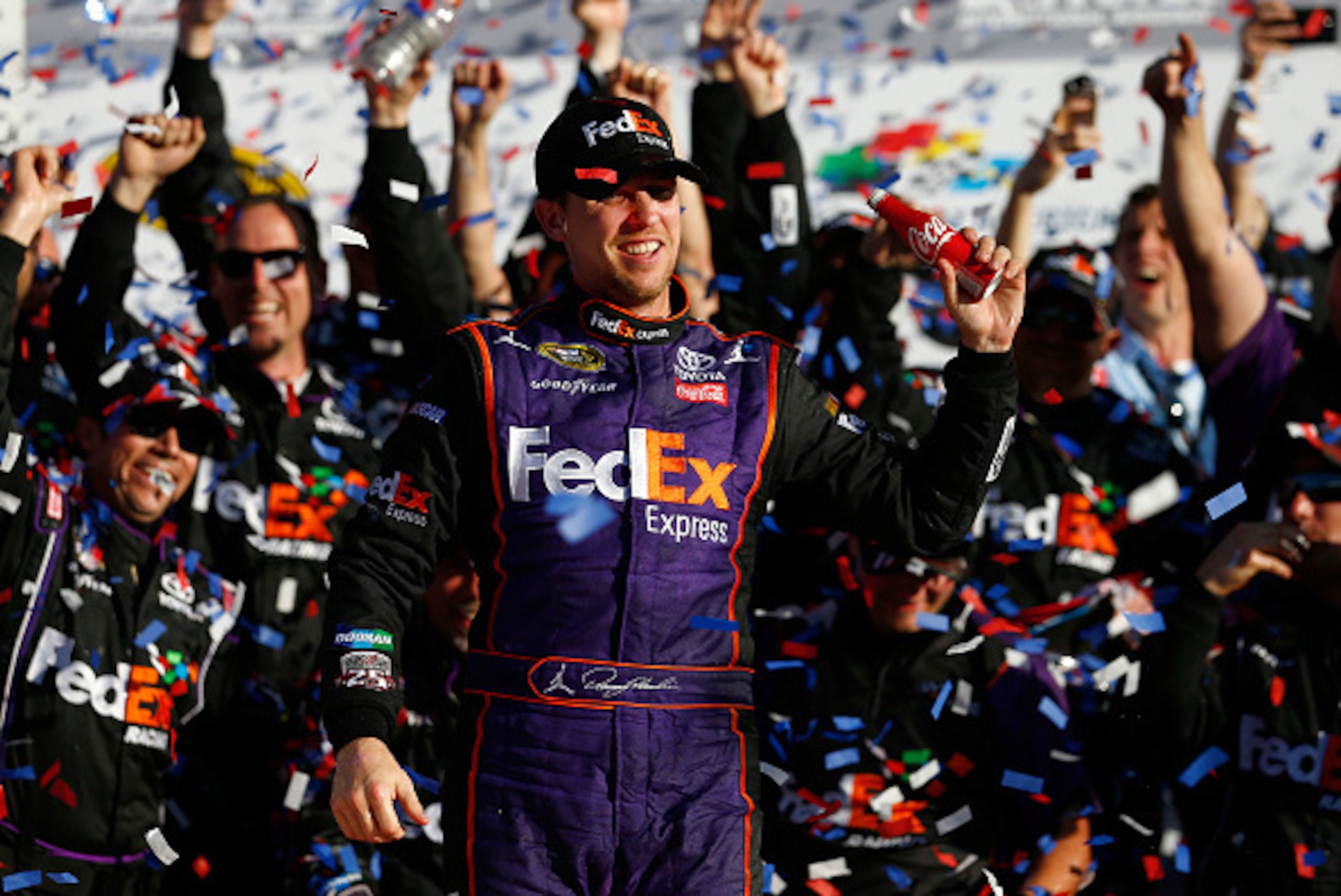DAYTONA BEACH, FL - FEBRUARY 21:  Denny Hamlin, driver of the #11 FedEx Express Toyota, celebrates in Victory Lane after winning the NASCAR Sprint Cup Series DAYTONA 500 at Daytona International Speedway on February 21, 2016 in Daytona Beach, Florida.  (P