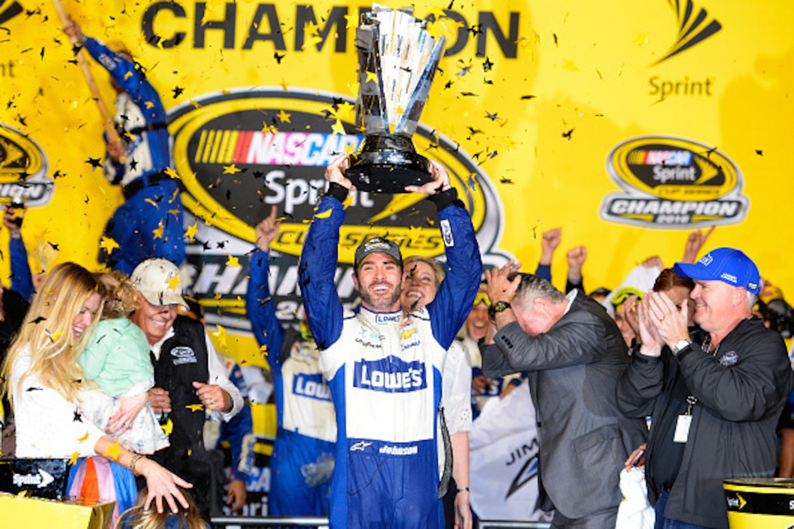 HOMESTEAD, FL - NOVEMBER 20:  Jimmie Johnson, driver of the #48 Lowe's Chevrolet, celebrates with the NASCAR Sprint Cup Series Championship trophy in Victory Lane after winning the NASCAR Sprint Cup Series Ford EcoBoost 400 and the 2016 NASCAR Sprint Cup 