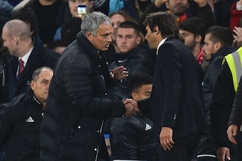 Manchester United's Portuguese manager Jose Mourinho (L) shakes hands with Chelsea's Italian head coach Antonio Conte (R) after the final whistle of the English Premier League football match between Chelsea and Manchester United at Stamford Bridge in Lond