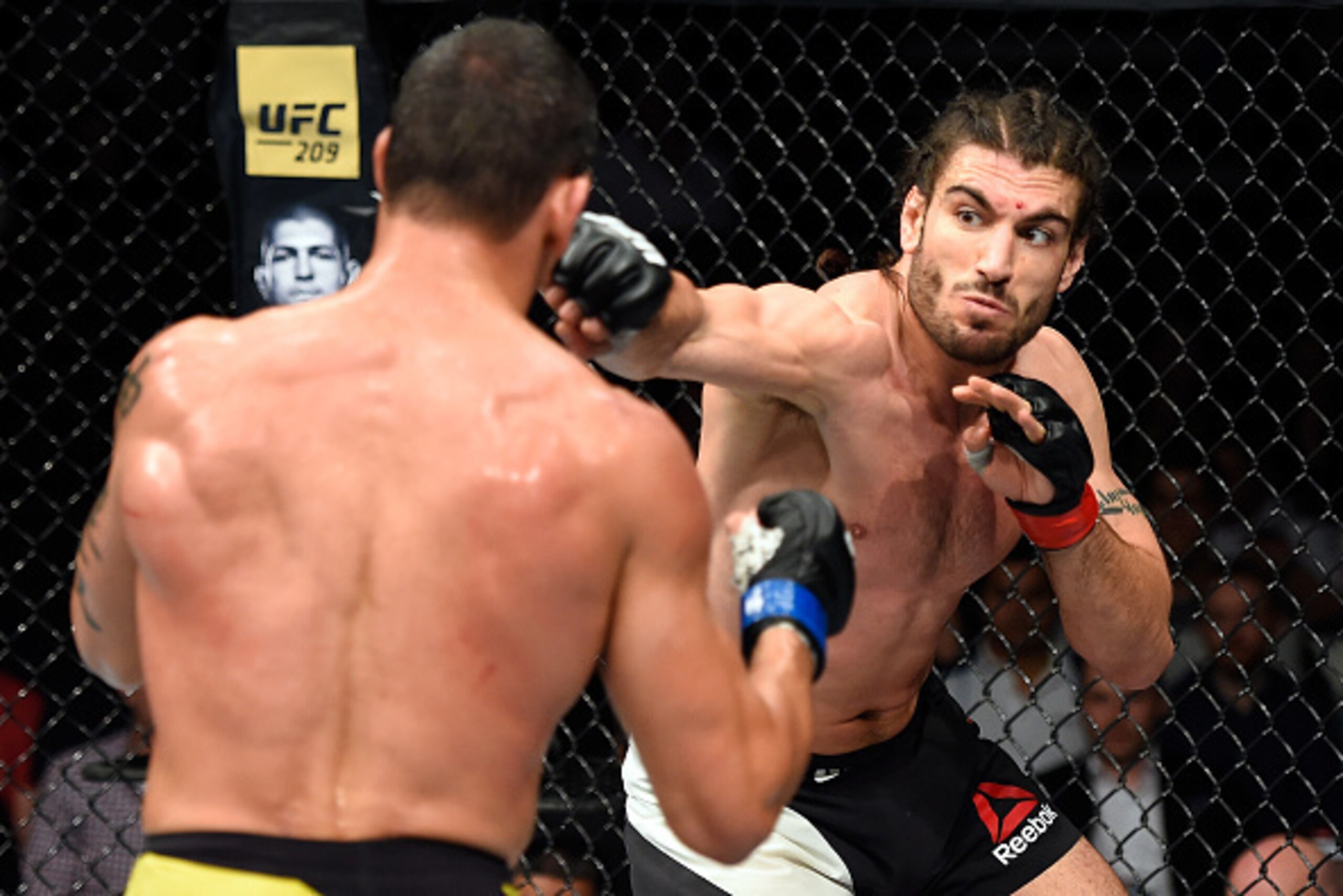 HALIFAX, NS - FEBRUARY 19:  (R-L) Elias Theodorou of Canada punches Cezar Ferreira of Brazil in their middleweight fight during the UFC Fight Night event inside the Scotiabank Centre on February 19, 2017 in Halifax, Nova Scotia, Canada. (Photo by Josh Hed