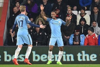 Manchester City's English midfielder Raheem Sterling (R) celebrates with Manchester City's Belgian midfielder Kevin De Bruyne after scoring the opening goal of the English Premier League football match between Bournemouth and Manchester City at the Vitali