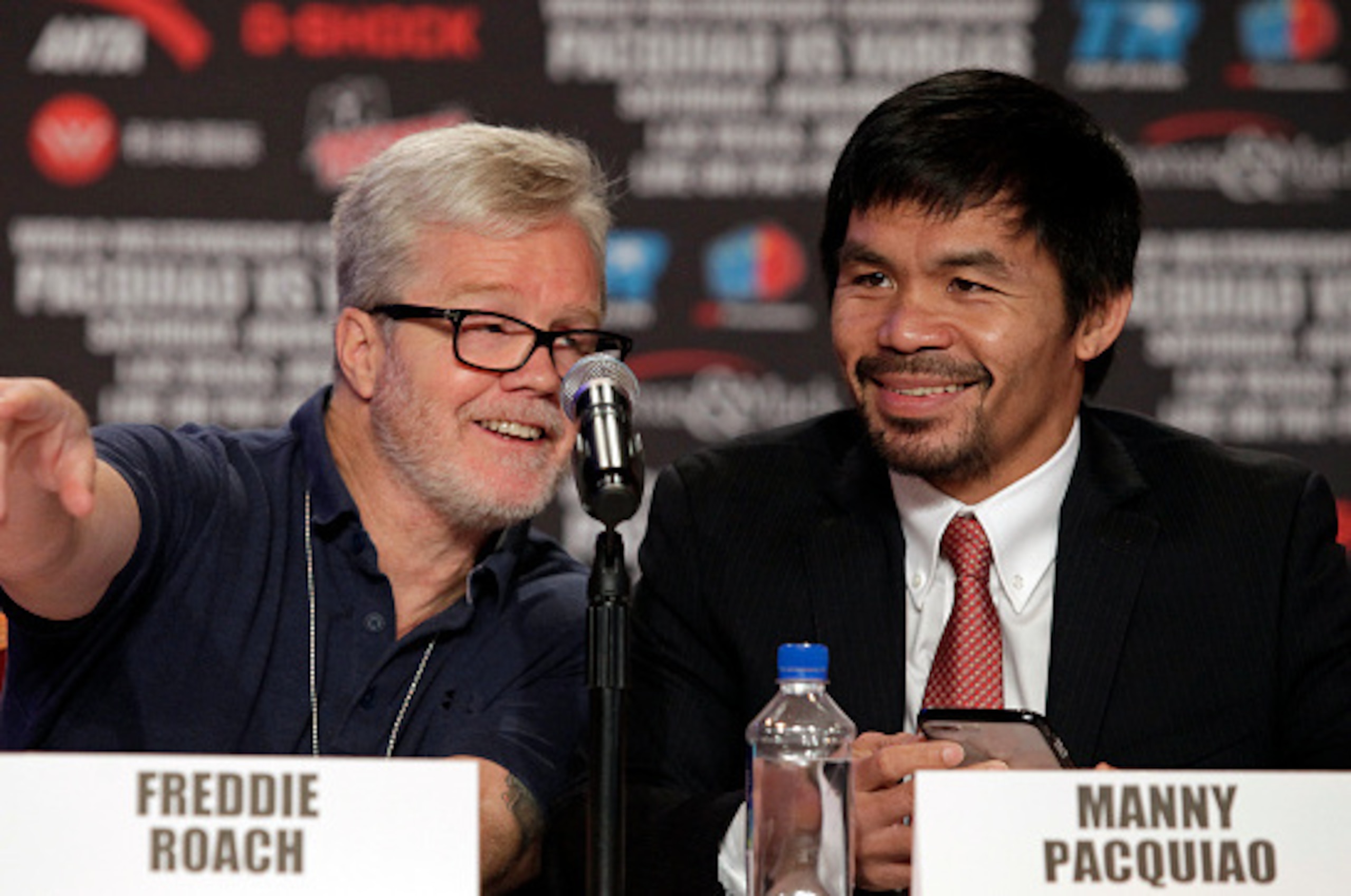 Trainer Freddie Roach(l)and Boxer Manny Pacquiao of the Philippines(R), talk during a news conference with Jessie Vargas, USA, at The Wynn Las Vegas, November 2, 2016.
Pacquiao will challenge Vargas for the WBO Welterweight Championship Saturday, November