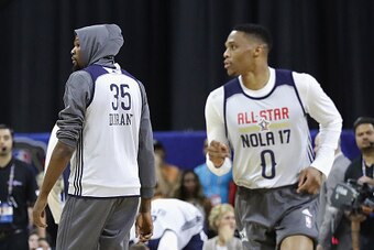 NEW ORLEANS, LA - FEBRUARY 18:  (EDITORS NOTE: Retransmission with alternate crop.) Kevin Durant #35 of the Golden State Warriors (L) and Russell Westbrook #0 of the Oklahoma City Thunder attend practice for the 2017 NBA All-Star Game at the Mercedes-Benz