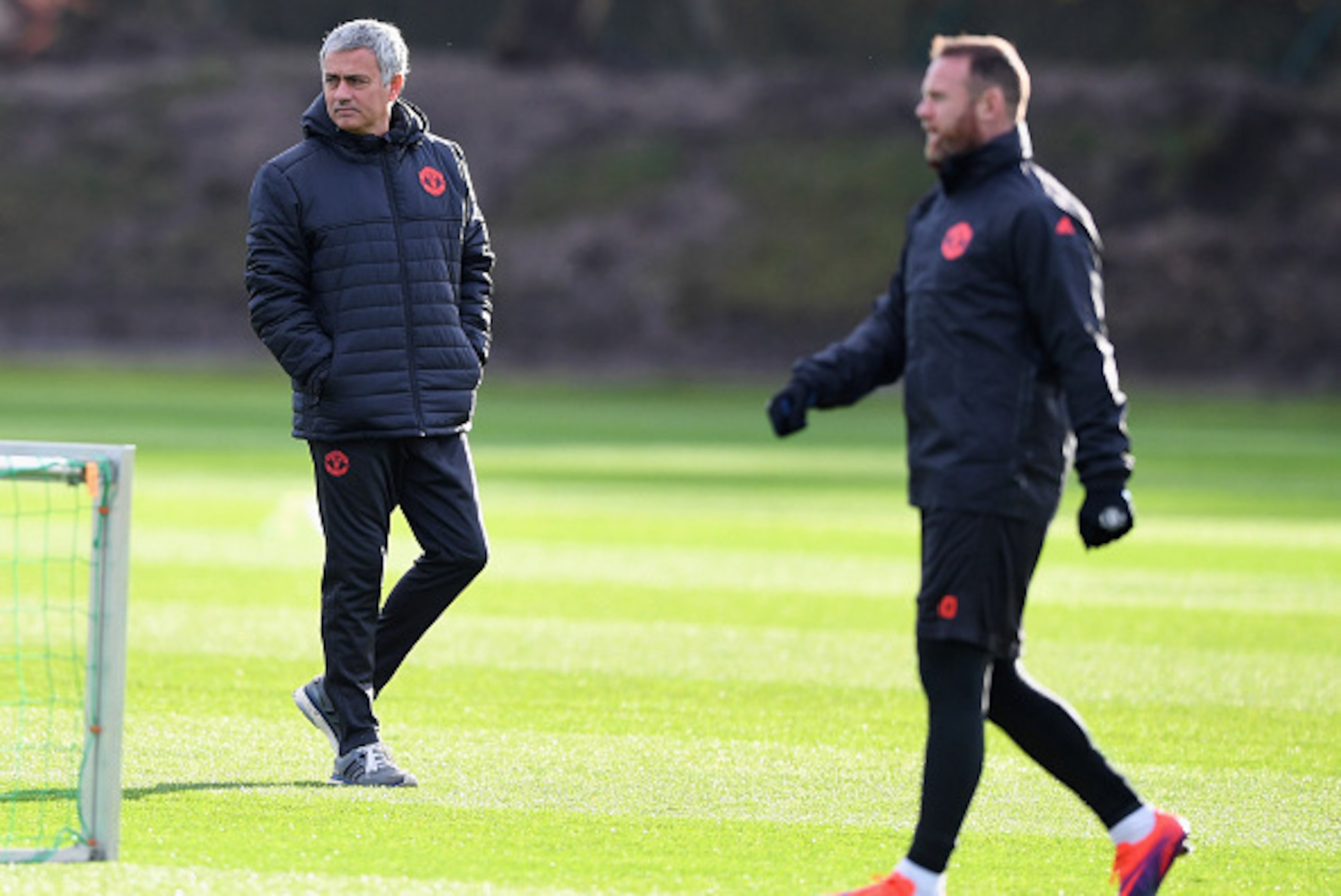 MANCHESTER, ENGLAND - NOVEMBER 23:  Jose Mourinho manager of Manchester United and Wayne Rooney look on during a Manchester United training session on the eve of their UEFA Europa League match against Feyenoord at Aon Training Complex on November 23, 2016