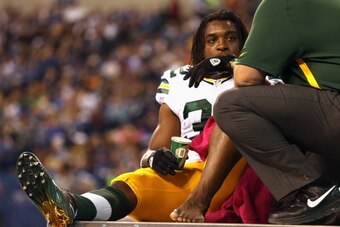 INDIANAOPLIS, IN - OCTOBER 7: Cedric Benson #32 of the Green Bay Packers is carted off of the field after suffering an injury against the Indianapolis Colts at Lucas Oil Stadium on October 7, 2012 in Indianapolis, Indiana. The Colts defeated the Packers 3