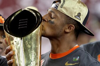 TAMPA, FL - JANUARY 09:  Quarterback Deshaun Watson #4 of the Clemson Tigers celebrates with the College Football Playoff National Championship Trophy after defeating the Alabama Crimson Tide 35-31 to win the 2017 College Football Playoff National Champio