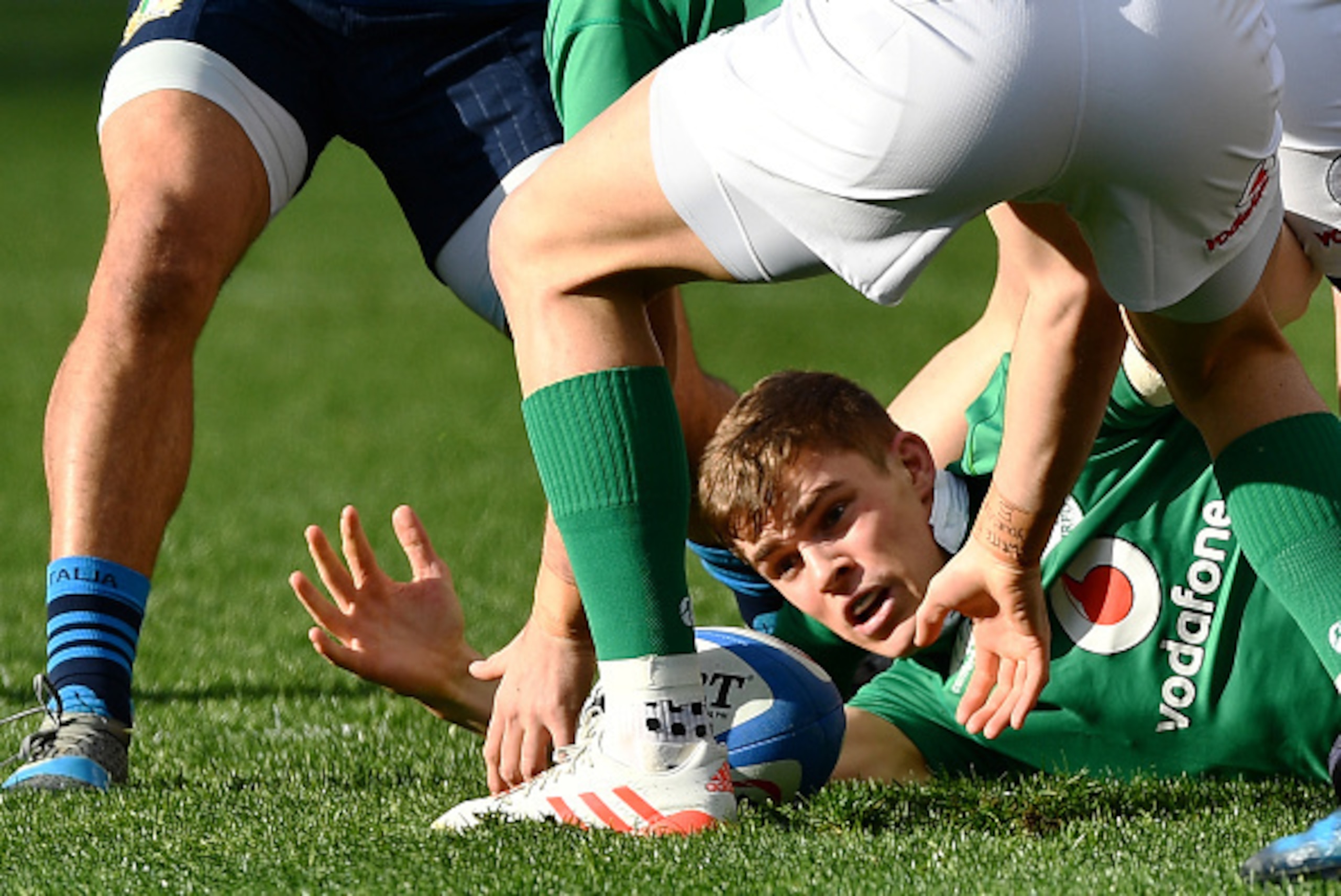 TOPSHOT - Ireland's Garry Ringrose (bottom) catches the ball during the team's Six Nations rugby union match Italy against Ireland at the Olympic Stadium in Rome on February 11, 2017.  / AFP / Vincenzo PINTO        (Photo credit should read VINCENZO PINTO
