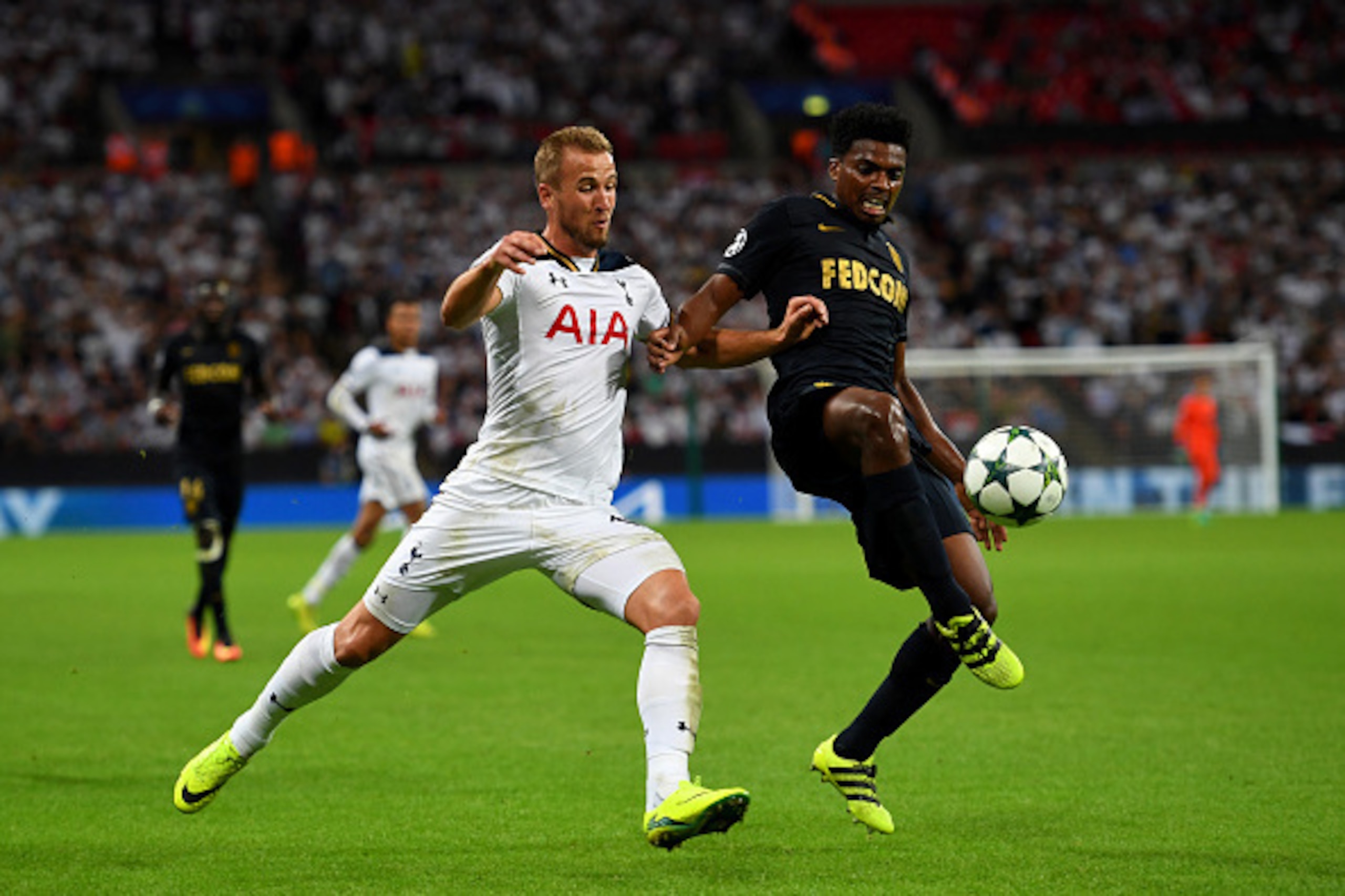 LONDON, ENGLAND - SEPTEMBER 14:  Harry Kane of Tottenham Hotspur battles for the ball with Jemerson of AS Monaco during the UEFA Champions League match between Tottenham Hotspur FC and AS Monaco FC at Wembley Stadium on September 14, 2016 in London, Engla