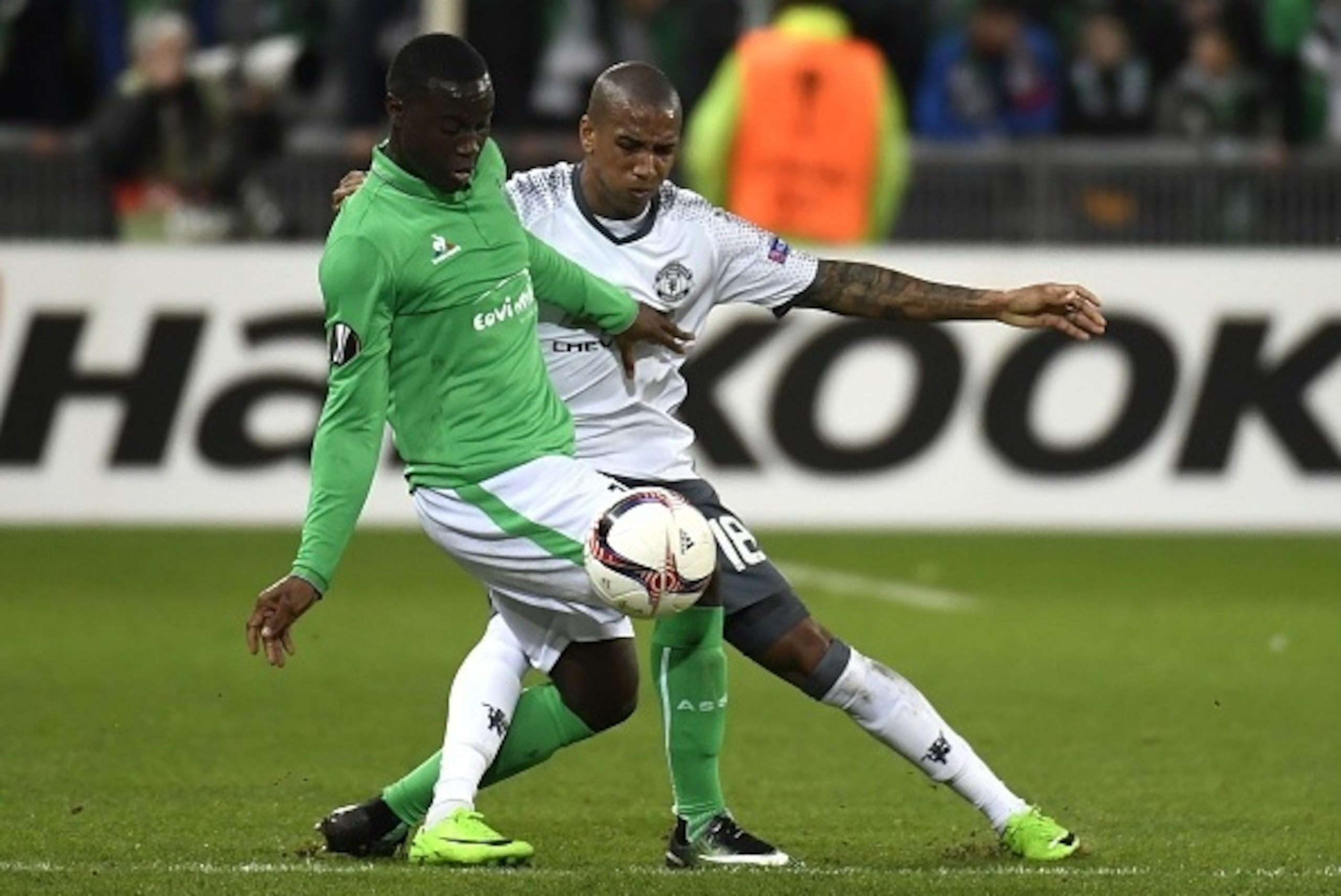 Saint-Etienne's French midfielder Henri Saivet (L) vies with Manchester United's British defender Ashley Young (R) during the UEFA Europa League football match between AS Saint-Etienne and Manchester United on February 22, 2017, at the Geoffroy Guichard s