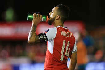 SUTTON, GREATER LONDON - FEBRUARY 20: Theo Walcott of Arsenal has a drink during The Emirates FA Cup Fifth Round match between Sutton United and Arsenal on February 20, 2017 in Sutton, Greater London. (Photo by Catherine Ivill - AMA/Getty Images)