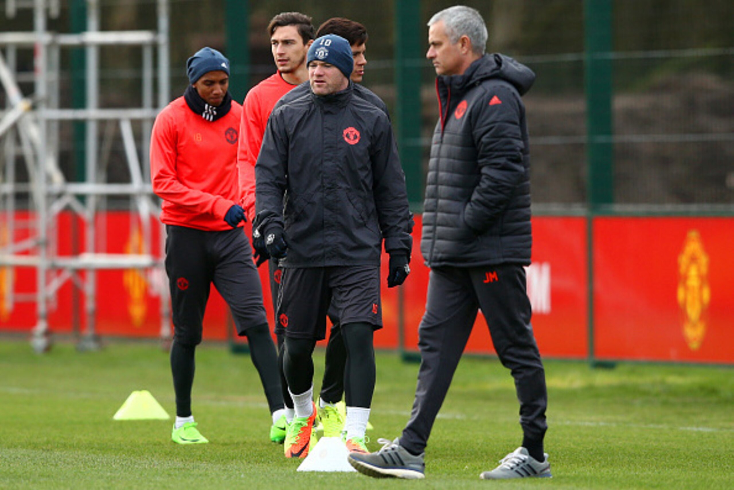 MANCHESTER, ENGLAND - FEBRUARY 21:  Jose Mourinho, manager of Manchester United walks past Wayne Rooney during a training session ahead of the UEFA Europa League round-of-32 second leg against St Etienne at Aon Training Complex on February 21, 2017 in Man