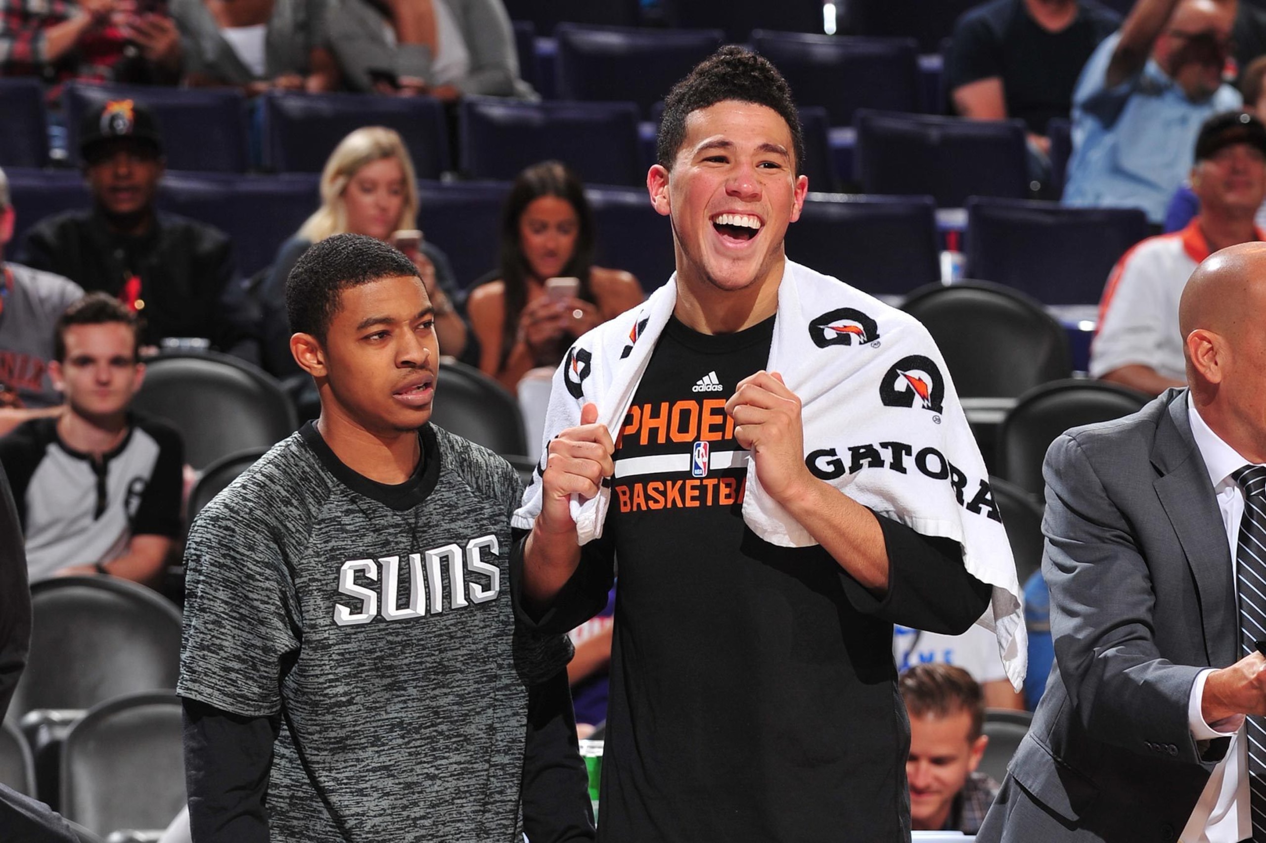 Tyler Ulis and Devin Booker of the Phoenix Suns stand together at a preseason game against the San Antonio Spurs on October 3, 2016 at Talking Stick Resort Arena in Phoenix, Arizona.