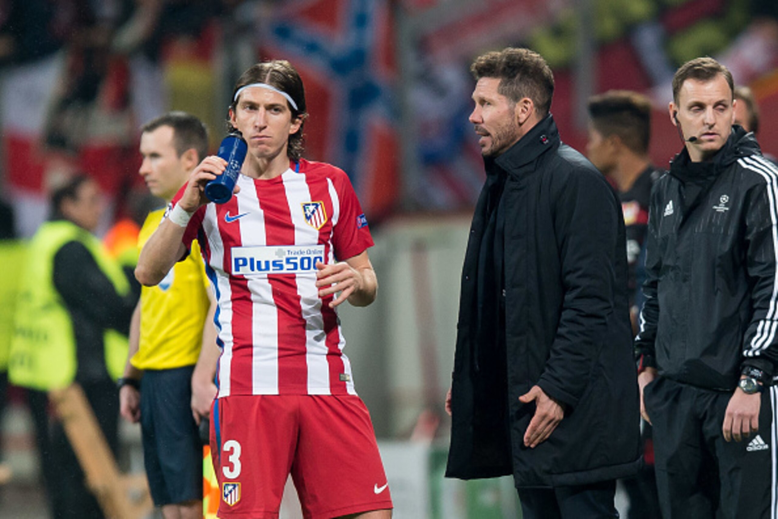 LEVERKUSEN, GERMANY - FEBRUARY 21: Filipe Luis of Atletico Madrid and Head coach Diego Simeone of Atletico Madrid look on during the UEFA Champions League Round of 16 first leg match between Bayer Leverkusen and Club Atletico de Madrid at BayArena on Febr