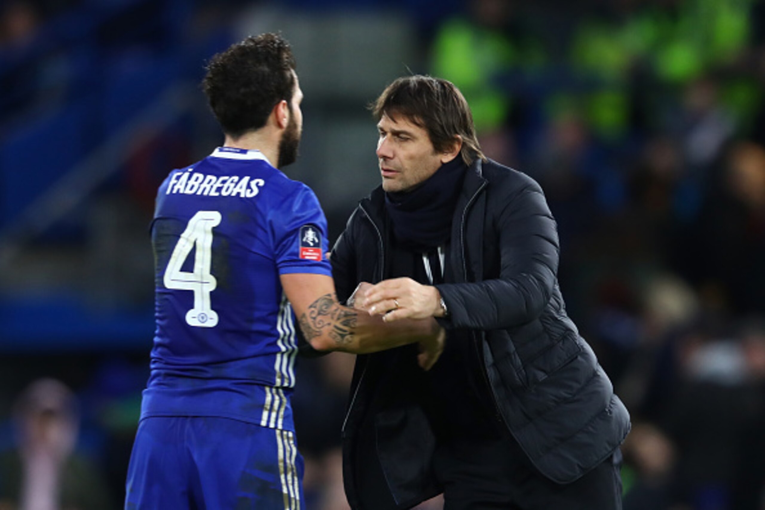 LONDON, ENGLAND - JANUARY 28: Antonio Conte, Manager of Chelsea speaks with Cesc Fabregas of Chelsea  during the Emirates FA Cup Fourth Round match between Chelsea and Brentford at Stamford Bridge on January 28, 2017 in London, England.  (Photo by Clive M