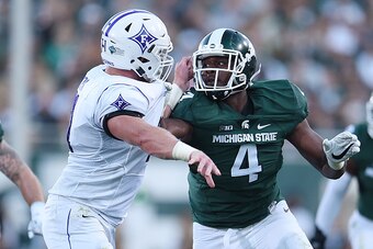EAST LANSING, MI - SEPTEMBER 02:  Malik McDowell #4 of the Michigan State Spartans works against Harrison Monk #71 of the Furman Paladins during the first half of a game at Spartan Stadium on September 2, 2016 in East Lansing, Michigan.  (Photo by Stacy R