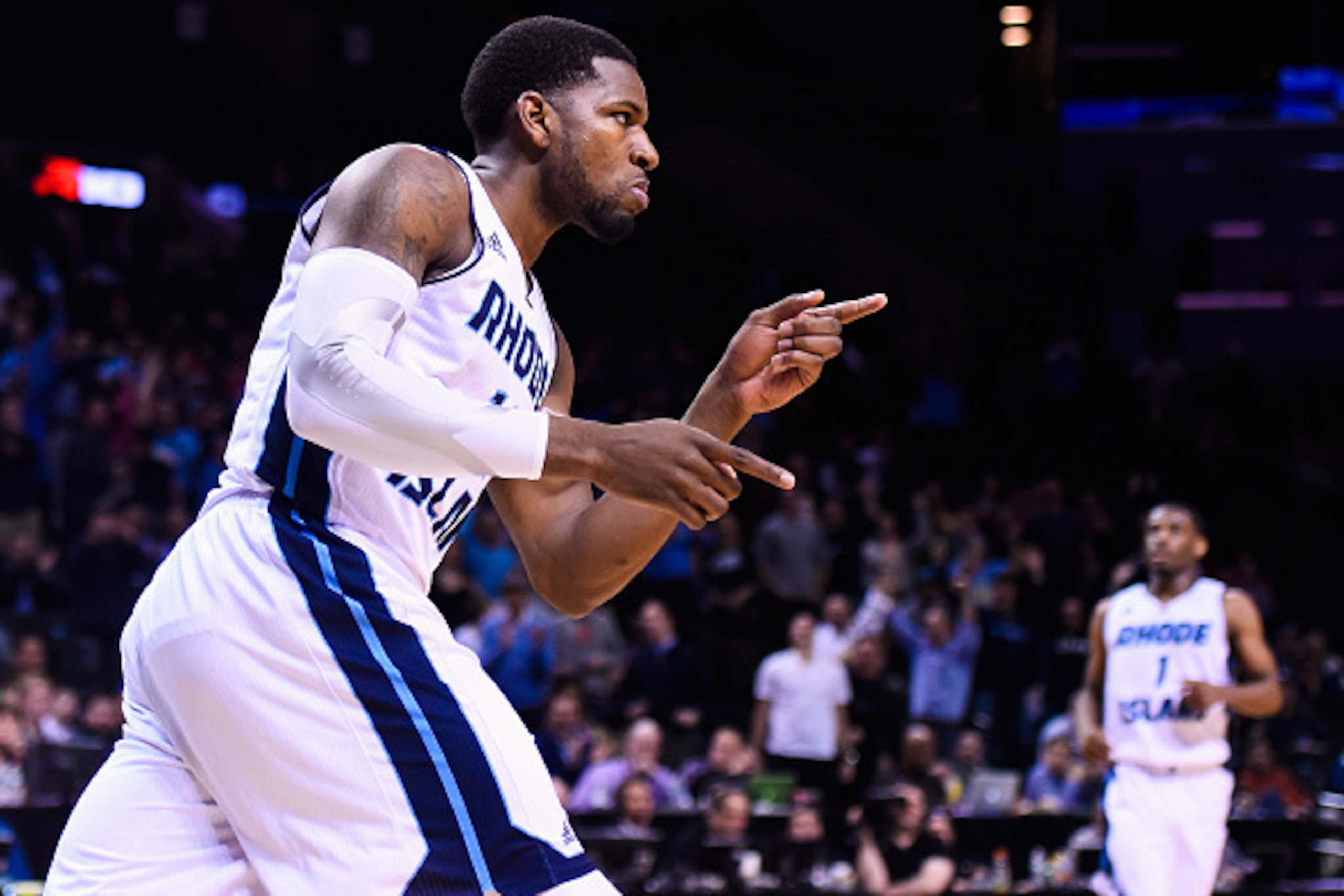 NEW YORK, NY - MARCH 13: Hassan Martin #12 of the Rhode Island Rams reacts to a dunk during a quarterfinal game against the George Washington Colonials in the 2015 Men's Atlantic 10 Basketball Tournament at the Barclays Center on March 13, 2015 in the Bro