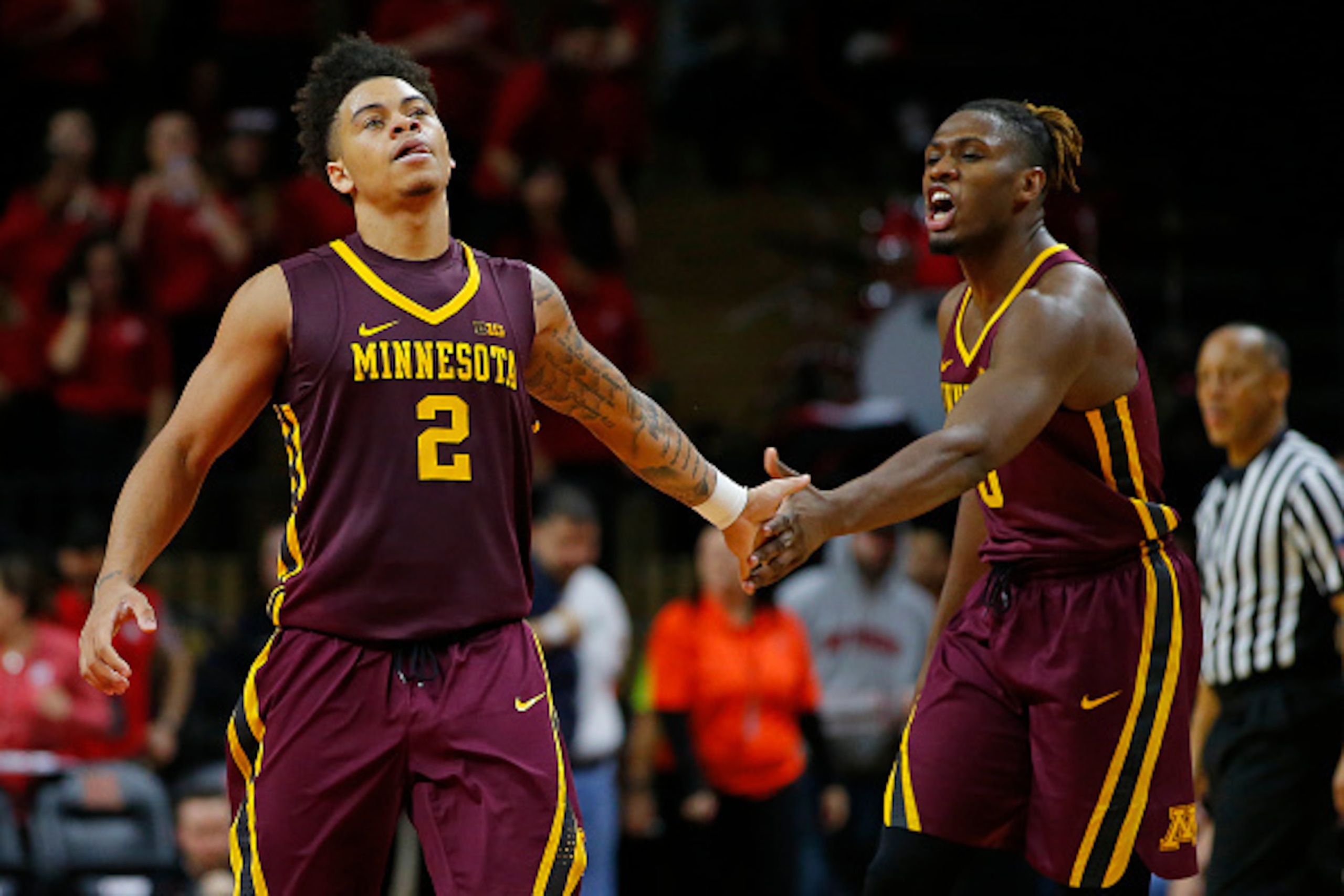 PISCATAWAY, NJ - FEBRUARY 11: Nate Mason #2 and Akeem Springs #0 of the Minnesota Golden Gophers in action against the Rutgers Scarlet Knights in an NCAA college basketball game at Rutgers Athletic Center on February 11, 2017 in Piscataway, New Jersey. Mi