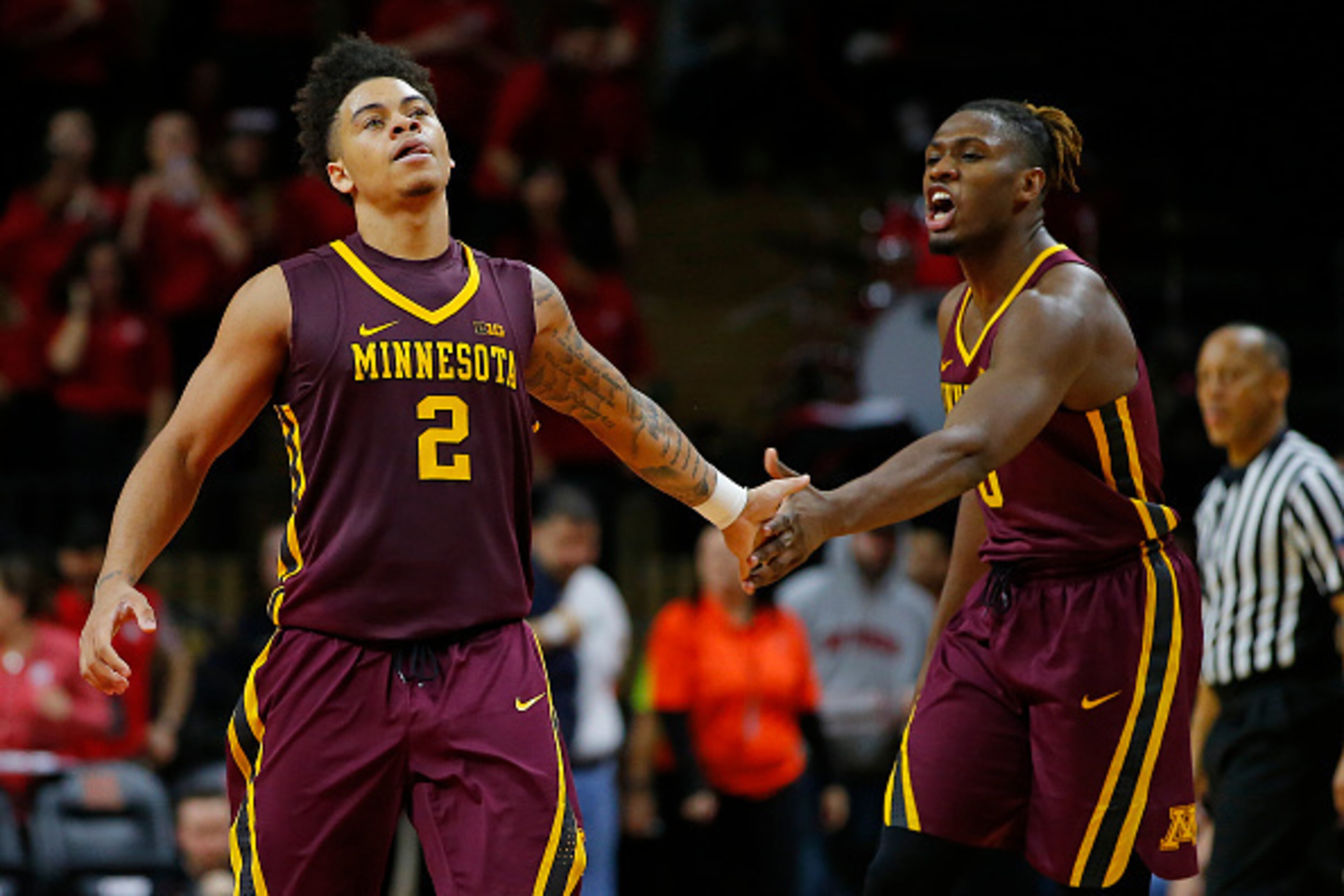 PISCATAWAY, NJ - FEBRUARY 11: Nate Mason #2 and Akeem Springs #0 of the Minnesota Golden Gophers in action against the Rutgers Scarlet Knights in an NCAA college basketball game at Rutgers Athletic Center on February 11, 2017 in Piscataway, New Jersey. Mi