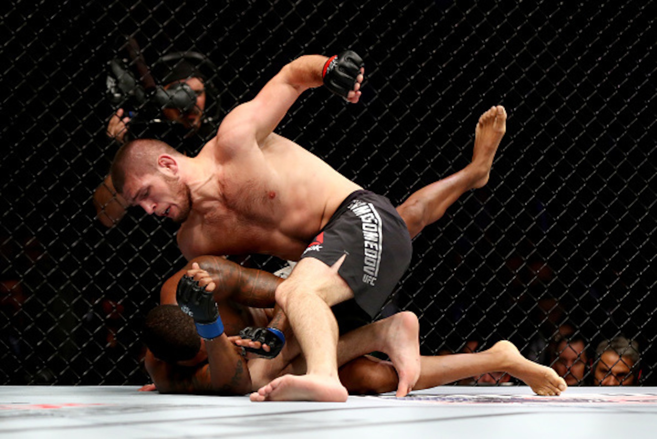 NEW YORK, NY - NOVEMBER 12:  Khabib Nurmagomedov of Russia (top) fights against Michael Johnson of the United States in their lightweight bout during the UFC 205 event at Madison Square Garden on November 12, 2016 in New York City.  (Photo by Al Bello/Zuf