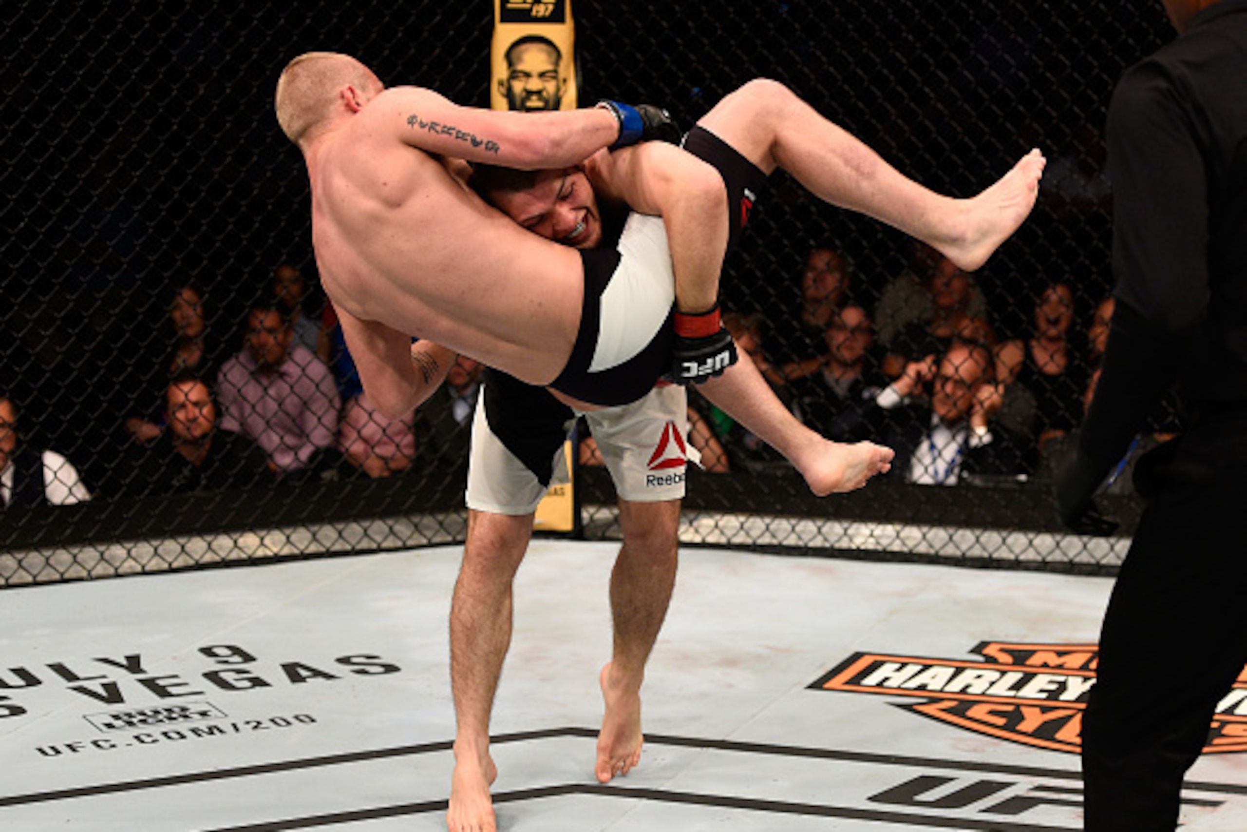 TAMPA, FL - APRIL 16:   (R-L) Khabib Nurmagomedov takes down Darrell Horcher in their lightweight bout during the UFC Fight Night event at Amalie Arena on April 16, 2016 in Tampa, Florida. (Photo by Jeff Bottari/Zuffa LLC/Zuffa LLC via Getty Images)