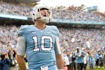 CHAPEL HILL, NC - NOVEMBER 07:  Mitch Trubisky #10 of the North Carolina Tar Heels reacts after scoring a touchdown against the Duke Blue Devils during their game at Kenan Stadium on November 7, 2015 in Chapel Hill, North Carolina. North Carolina won 66-3