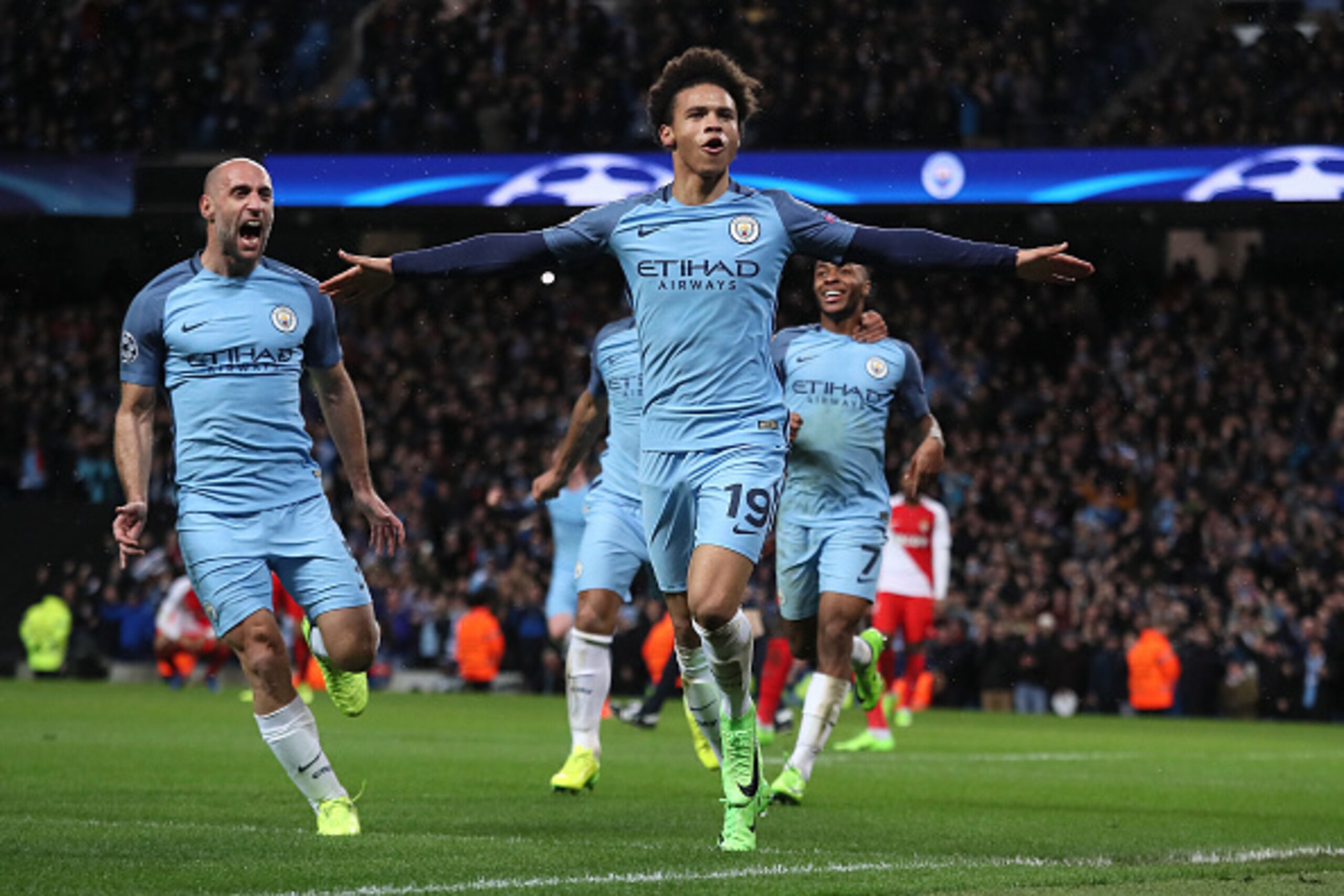 MANCHESTER, ENGLAND - FEBRUARY 21:  Leroy Sane of Manchester City celebrates scoring his team's fifth goal to make the score 5-3 during the UEFA Champions League Round of 16 first leg match between Manchester City FC and AS Monaco at Etihad Stadium on Feb