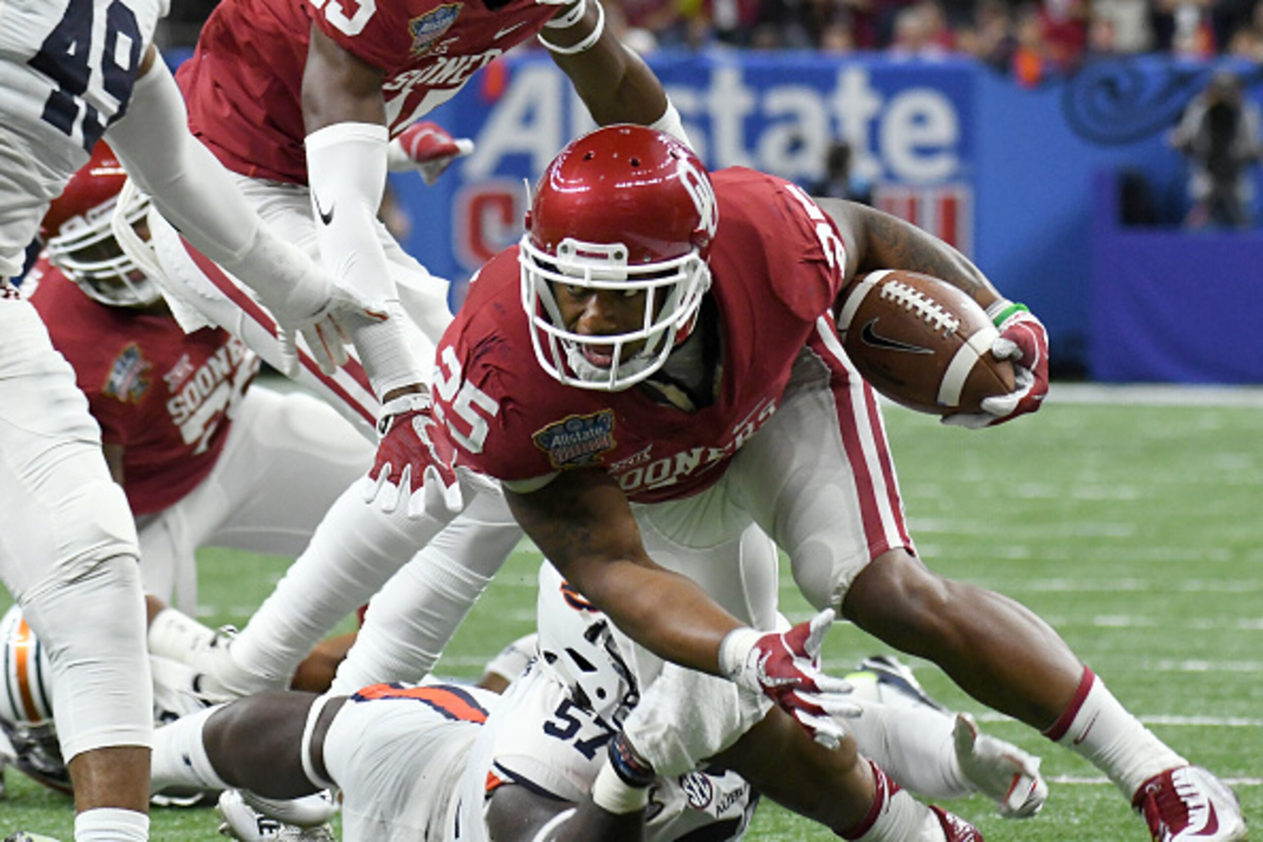 NEW ORLEANS, LA - JANUARY 02: Running back Joe Mixon #25 of the Oklahoma Sooners looks for extra yardage during their victory in the Sugar Bowl against the Auburn Tigers on January 2, 2017 at The Superdome  in New Orleans, Louisiana. (Photo by Jackson Lai