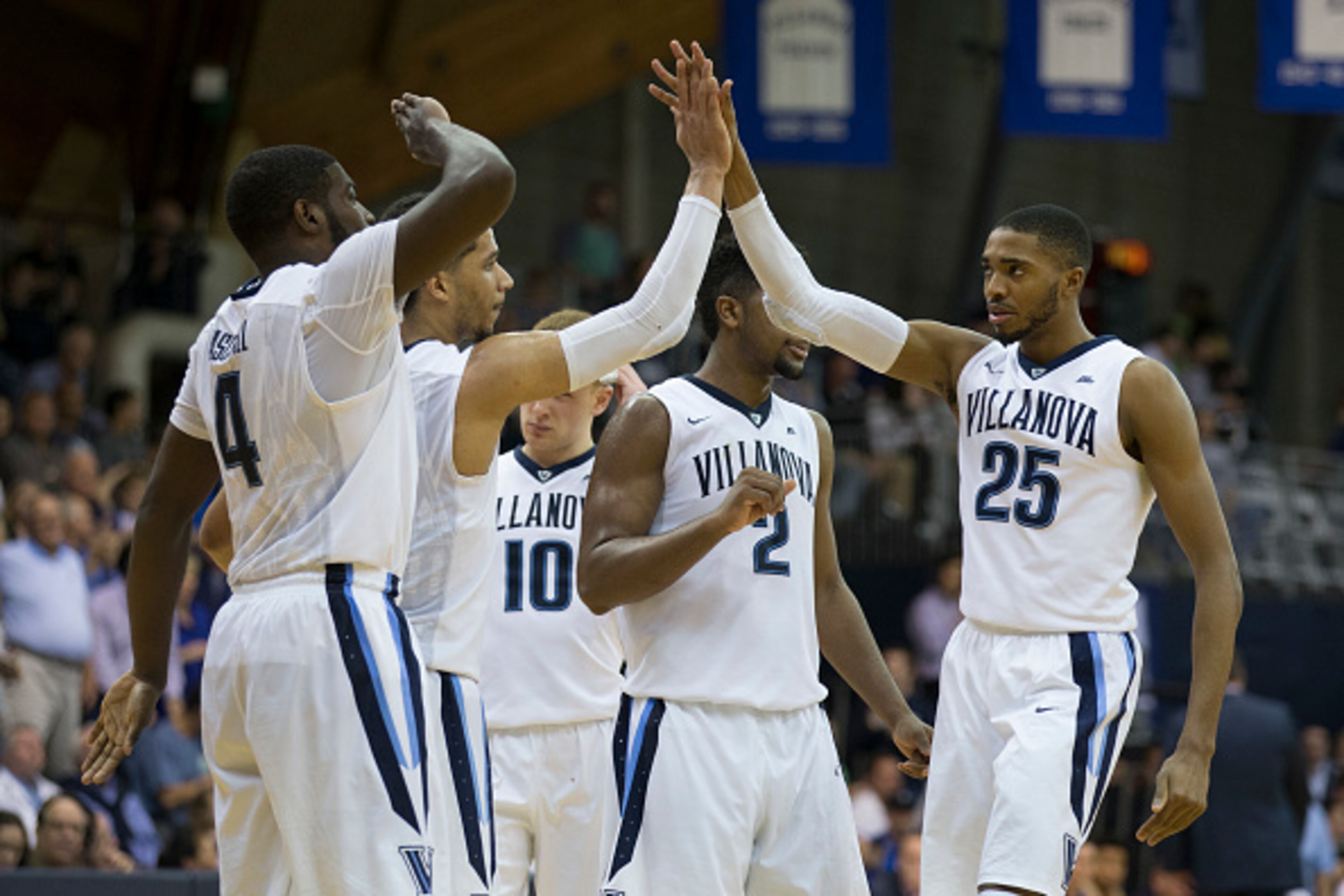 PHILADELPHIA, PA - FEBRUARY 25: Eric Paschall #4, Josh Hart #3, Donte DiVincenzo #10, Kris Jenkins #2, and Mikal Bridges #25 of the Villanova Wildcats celebrate in the second half against the Creighton Bluejays at the Pavilion on February 25, 2017 in Vill