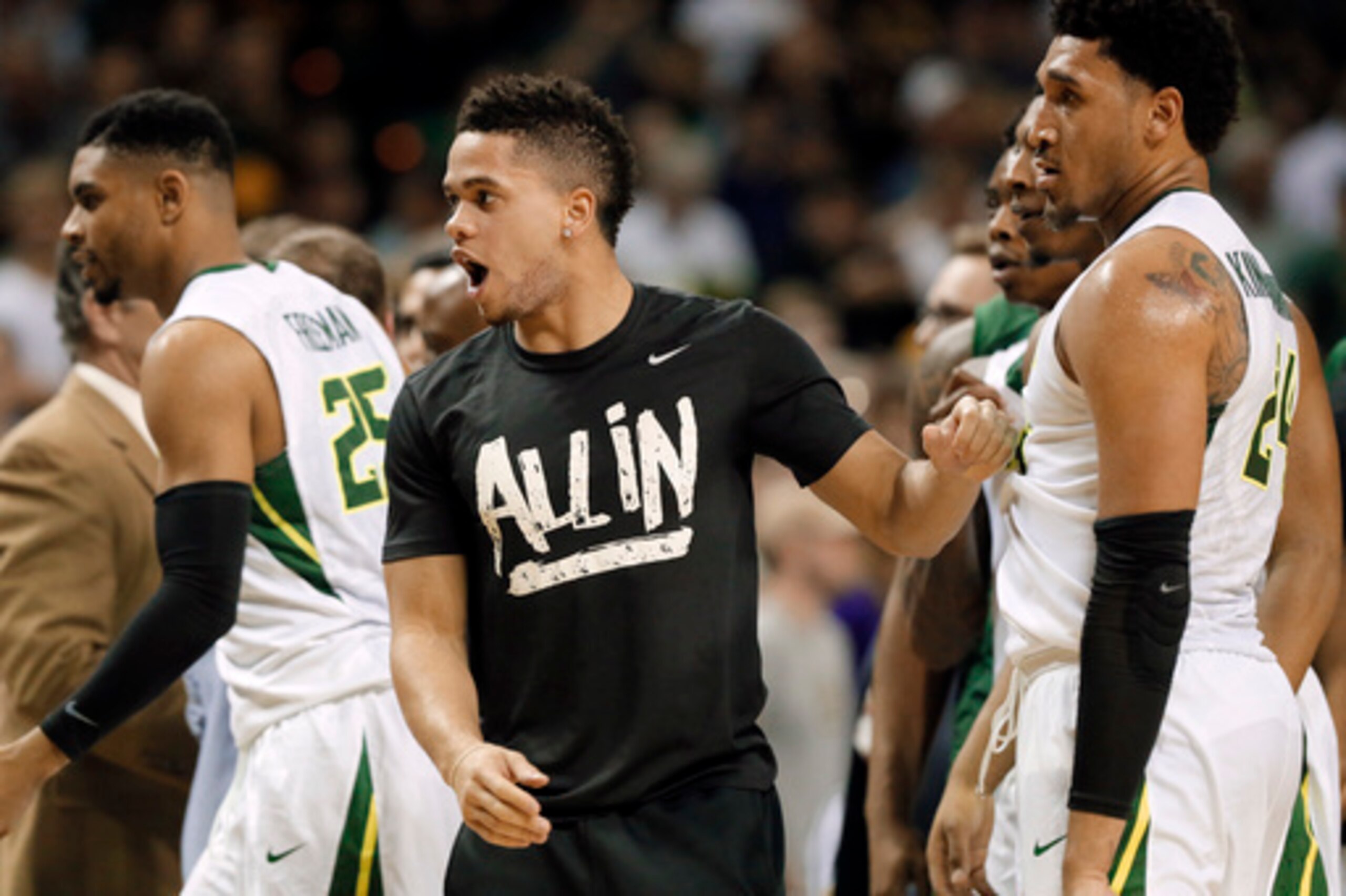 Baylor guard Manu Lecomte, center, did not play Monday because of an ankle injury.