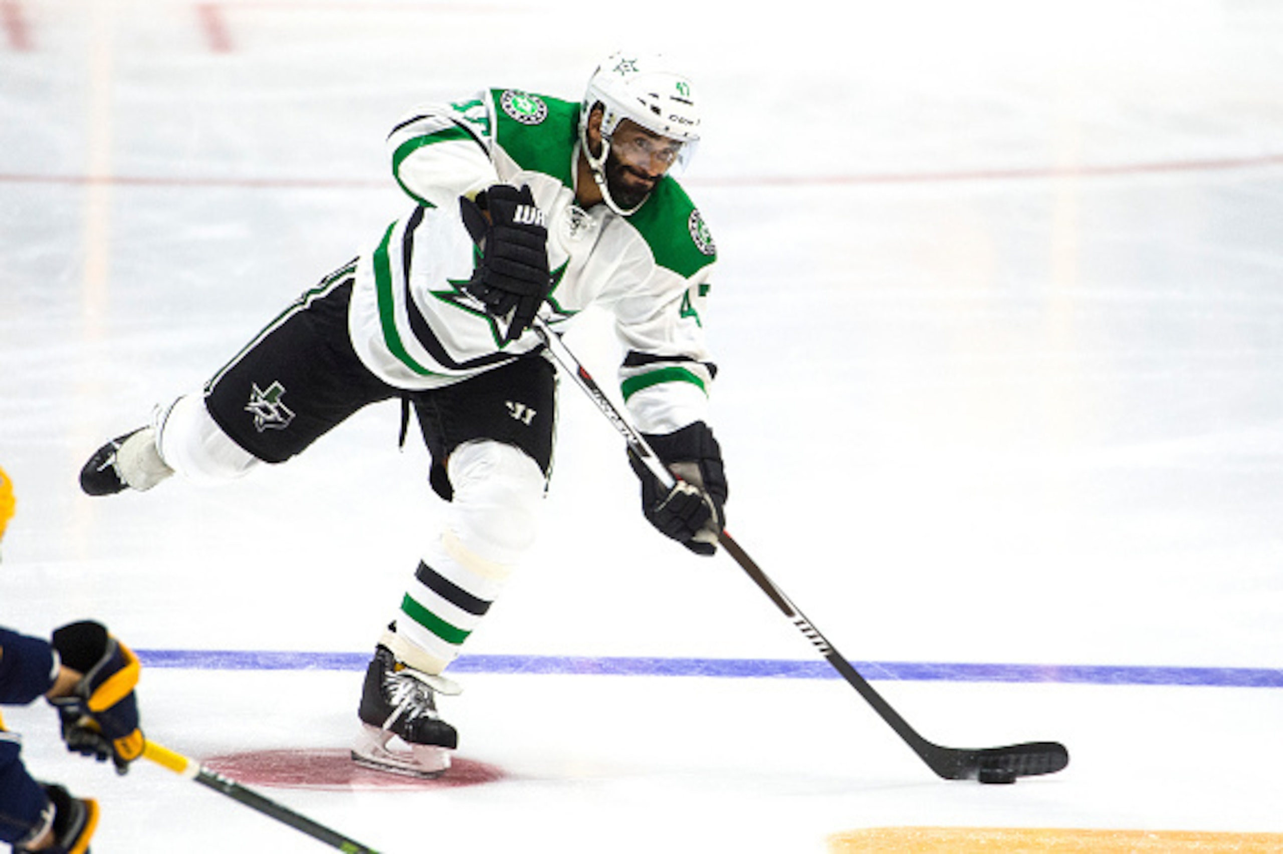NASHVILLE, TN - OCTOBER 18:  Johnny Oduya #47 of the Dallas Stars skates with the puck against the Nashville Predators during an NHL game at Bridgestone Arena on October 18, 2016 in Nashville, Tennessee.  (Photo by Ronald C. Modra/NHL/Getty Images)