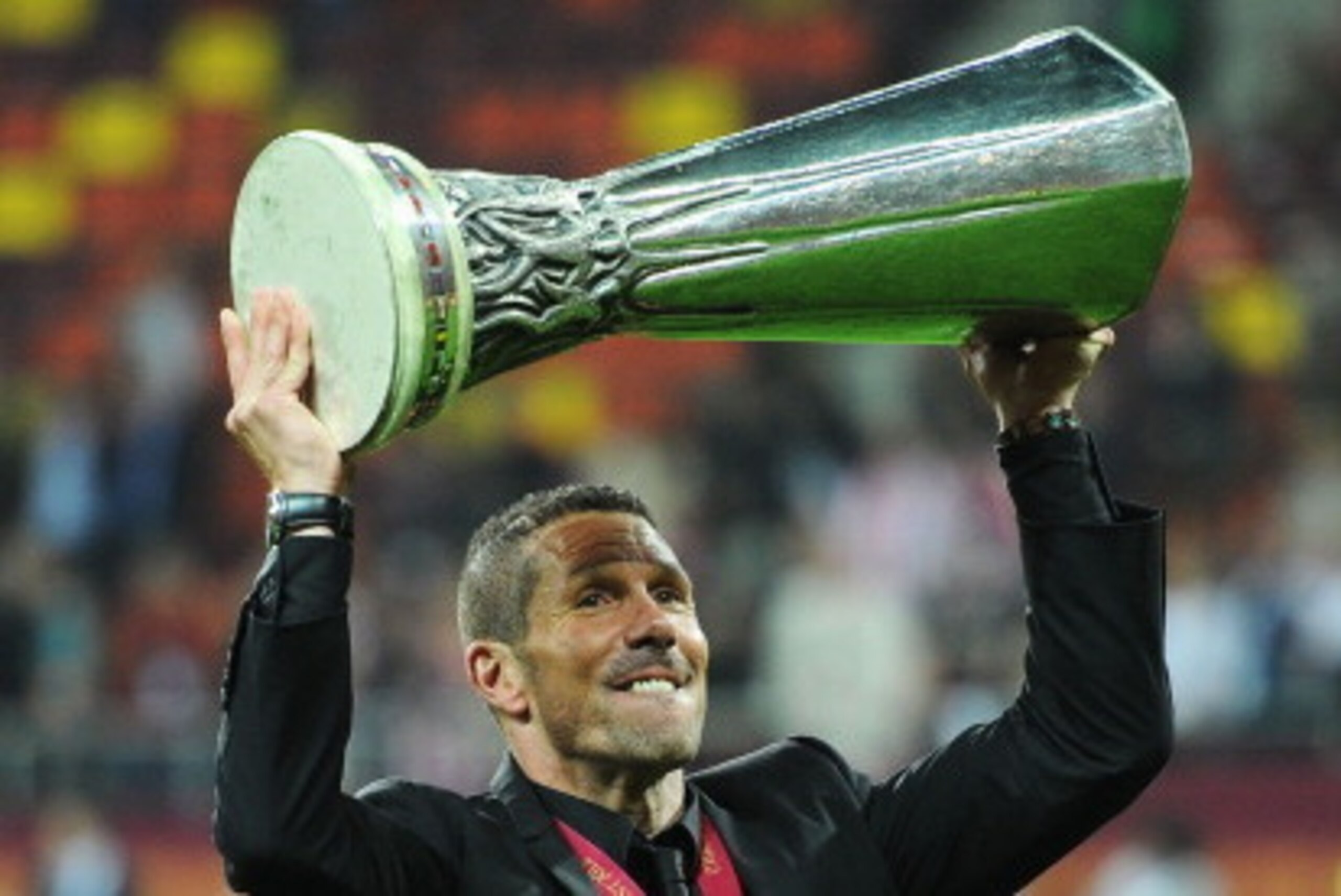BUCHAREST, ROMANIA - MAY 09:  Atletico Madrid Coach Diego Simeone holds the trophy aloft at the end of the UEFA Europa League Final between Atletico Madrid and Athletic Bilbao at the National Arena on May 9, 2012 in Bucharest, Romania.  (Photo by Michael 