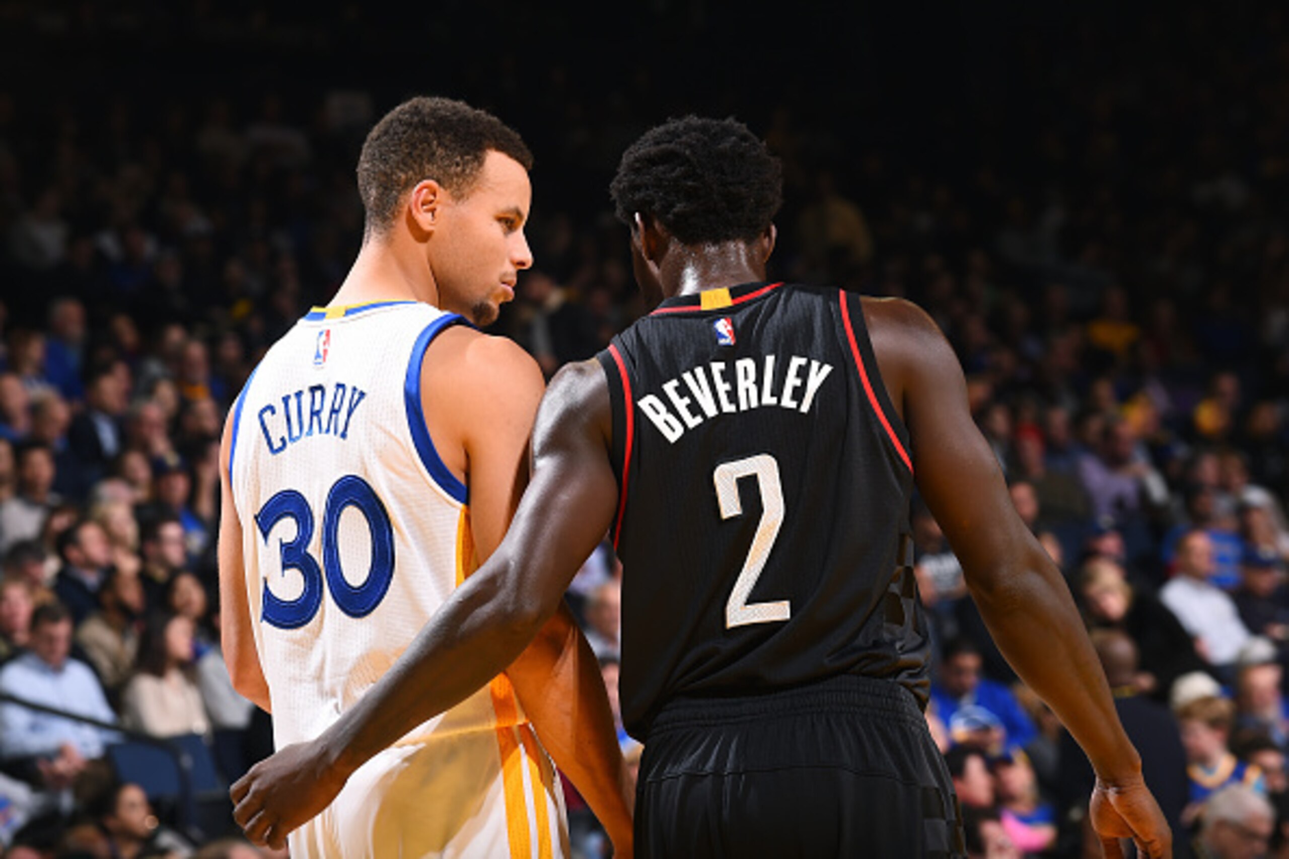 OAKLAND, CA - DECEMBER 1: Stephen Curry #30 of the Golden State Warriors talks with Patrick Beverley #2 of the Houston Rockets during the game on December 1, 2016 at ORACLE Arena in Oakland, California. NOTE TO USER: User expressly acknowledges and agrees