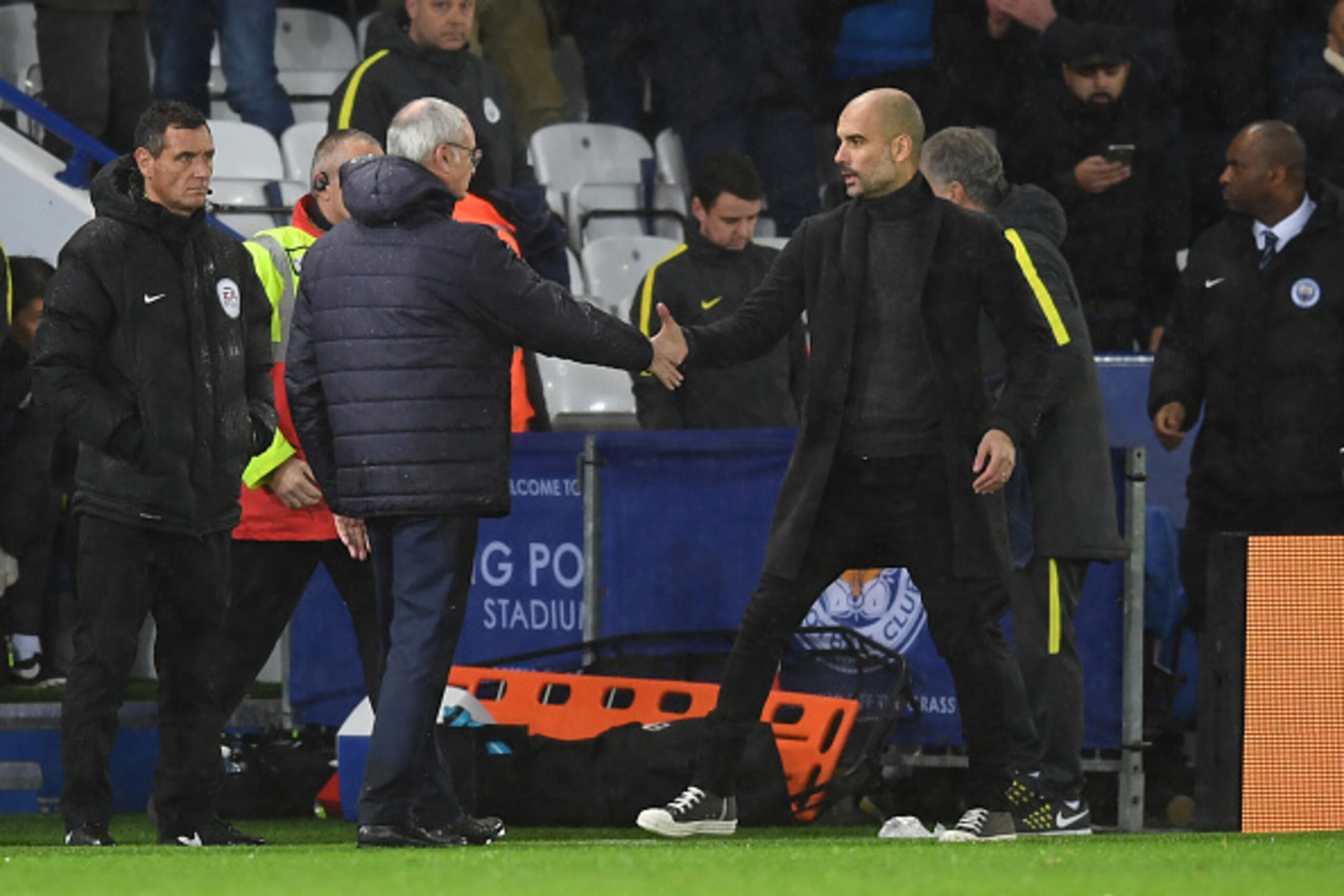 LEICESTER, ENGLAND - DECEMBER 10:  Claudio Ranieri, Manager of Leicester City (L) and Josep Guardiola, Manager of Manchester City (R) shake hands after the final whistle during the Premier League match between Leicester City and Manchester City at the Kin