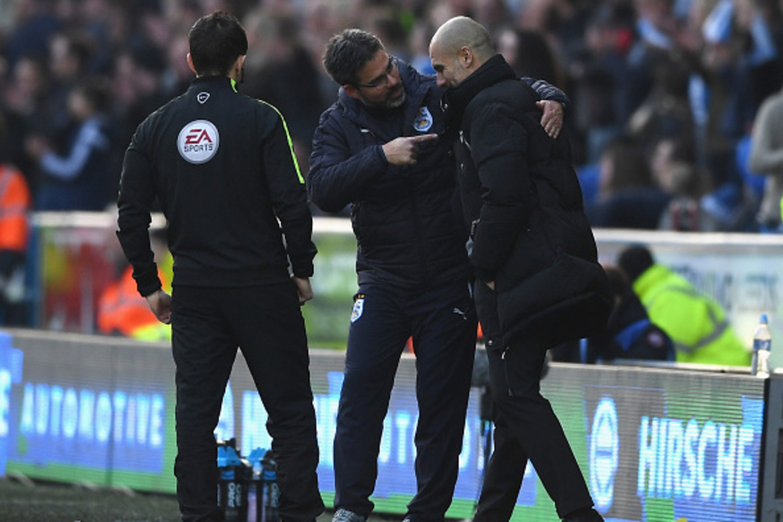 HUDDERSFIELD, ENGLAND - FEBRUARY 18:  David Wagner, Manager of Huddersfield Town (L) and Josep Guardiola, Manager of Manchester City (R) embrace after The Emirates FA Cup Fifth Round match between Huddersfield Town and Manchester City at John Smith's Stad