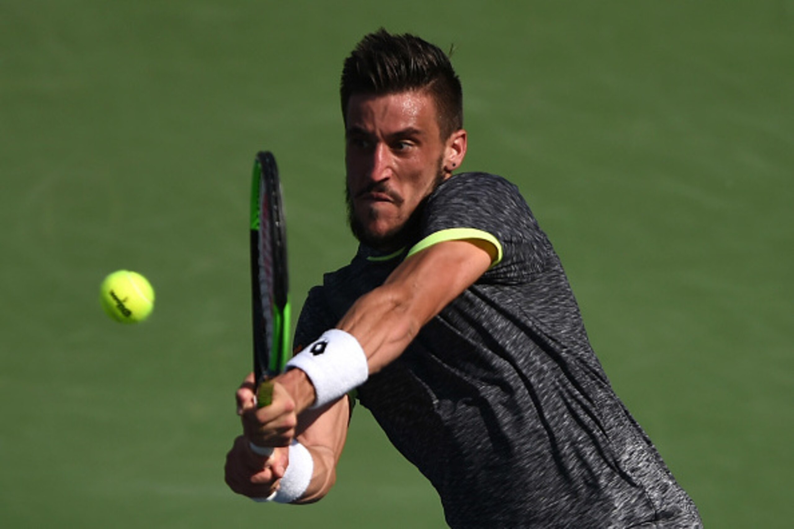 DUBAI, UNITED ARAB EMIRATES - FEBRUARY 28:  Damir Dzumhur of Bosnia and Herzegovina plays a backhand during his match against Stan Wawrinka of Switzerland on day three of the ATP Dubai Duty Free Tennis Championship on February 28, 2017 in Dubai, United Ar