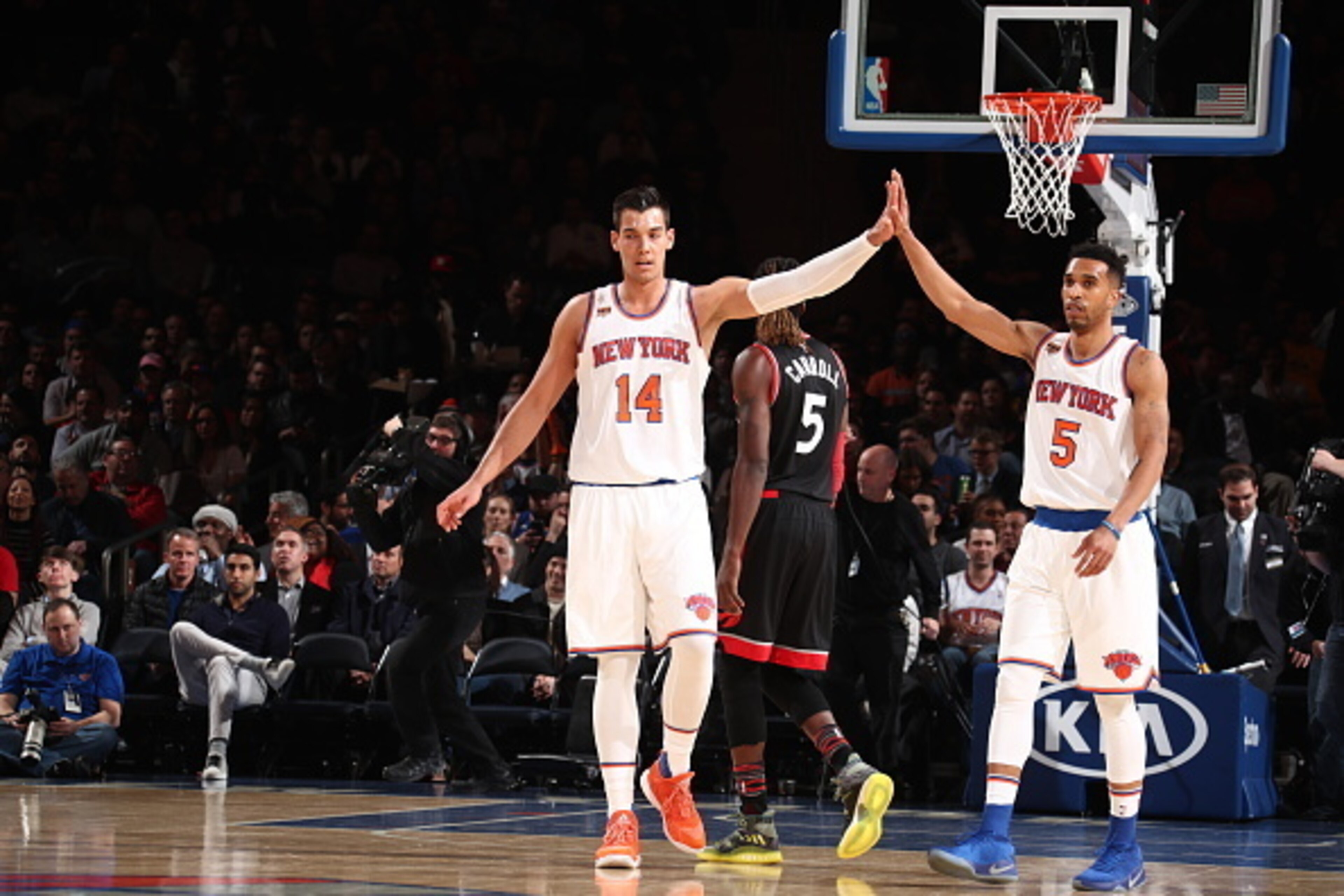 NEW YORK, NY - FEBRUARY 27: Willy Hernangomez #14 and Courtney Lee #5 New York Knicks high five against the Toronto Raptors on February 27, 2017 at Madison Square Garden in New York City.  NOTE TO USER: User expressly acknowledges and agrees that, by down